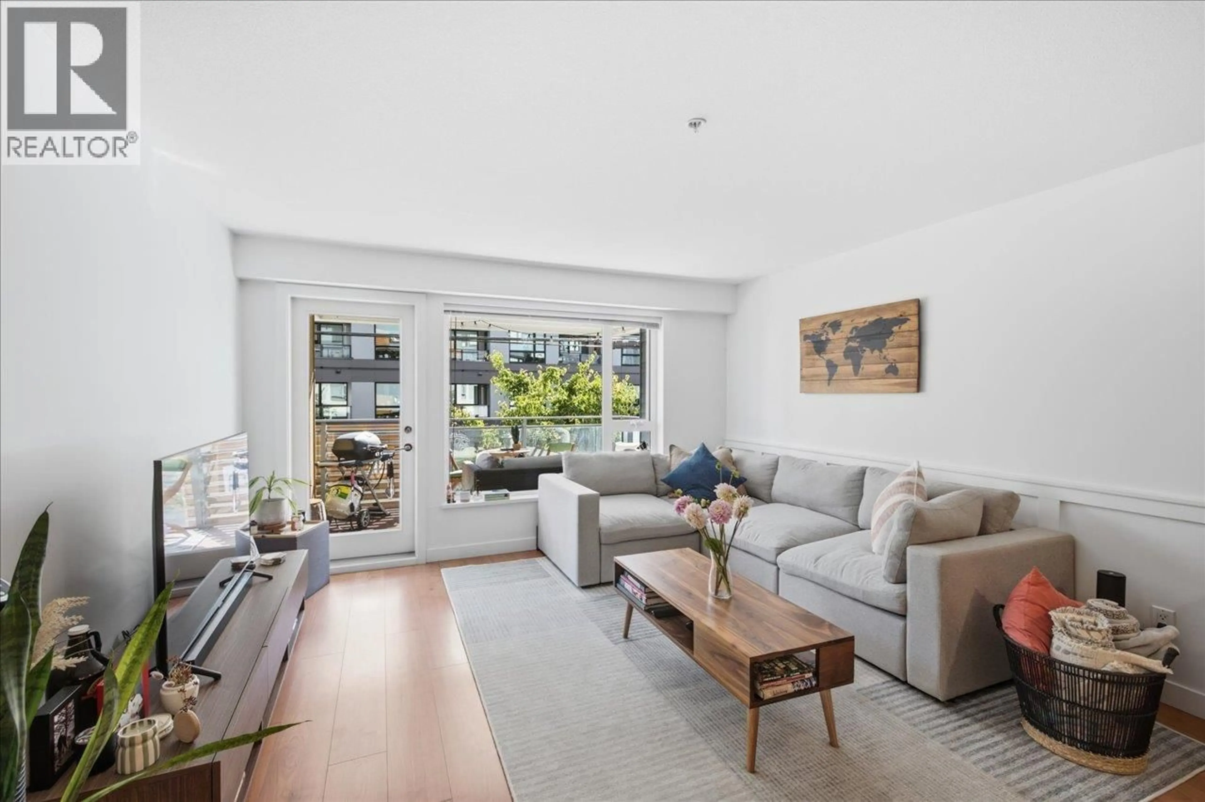 Living room with furniture, unknown for 102 - 221 3RD STREET, North Vancouver British Columbia V7L0C1