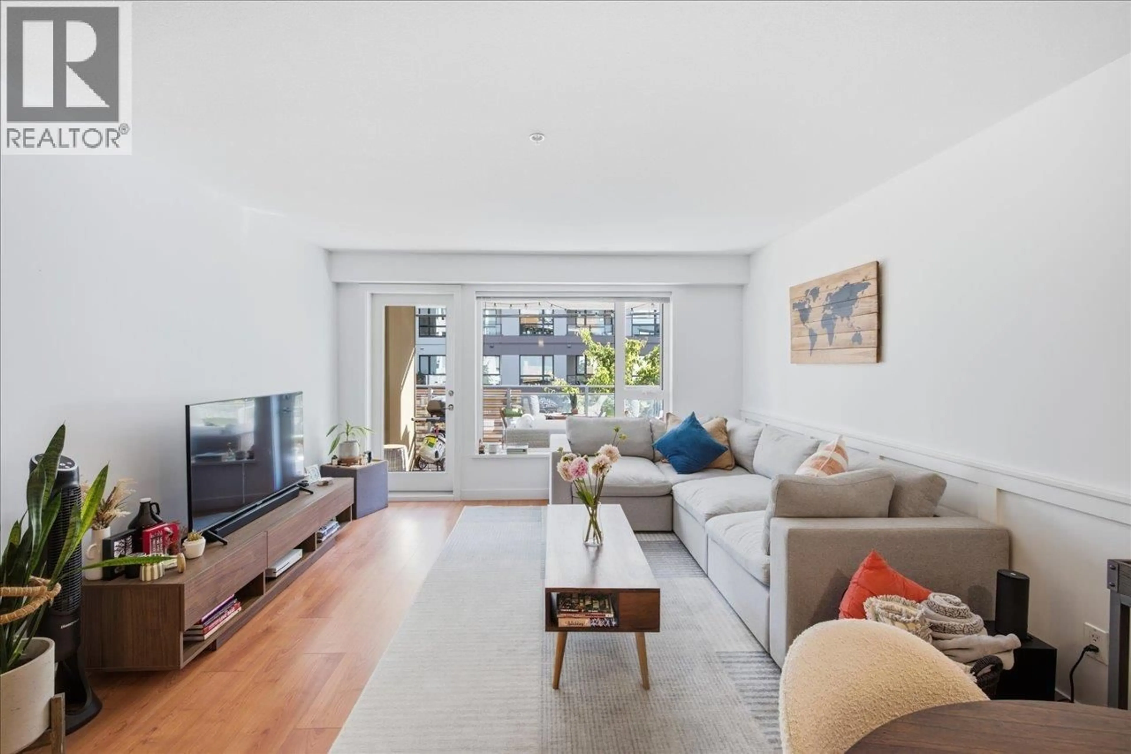 Living room with furniture, unknown for 102 - 221 3RD STREET, North Vancouver British Columbia V7L0C1