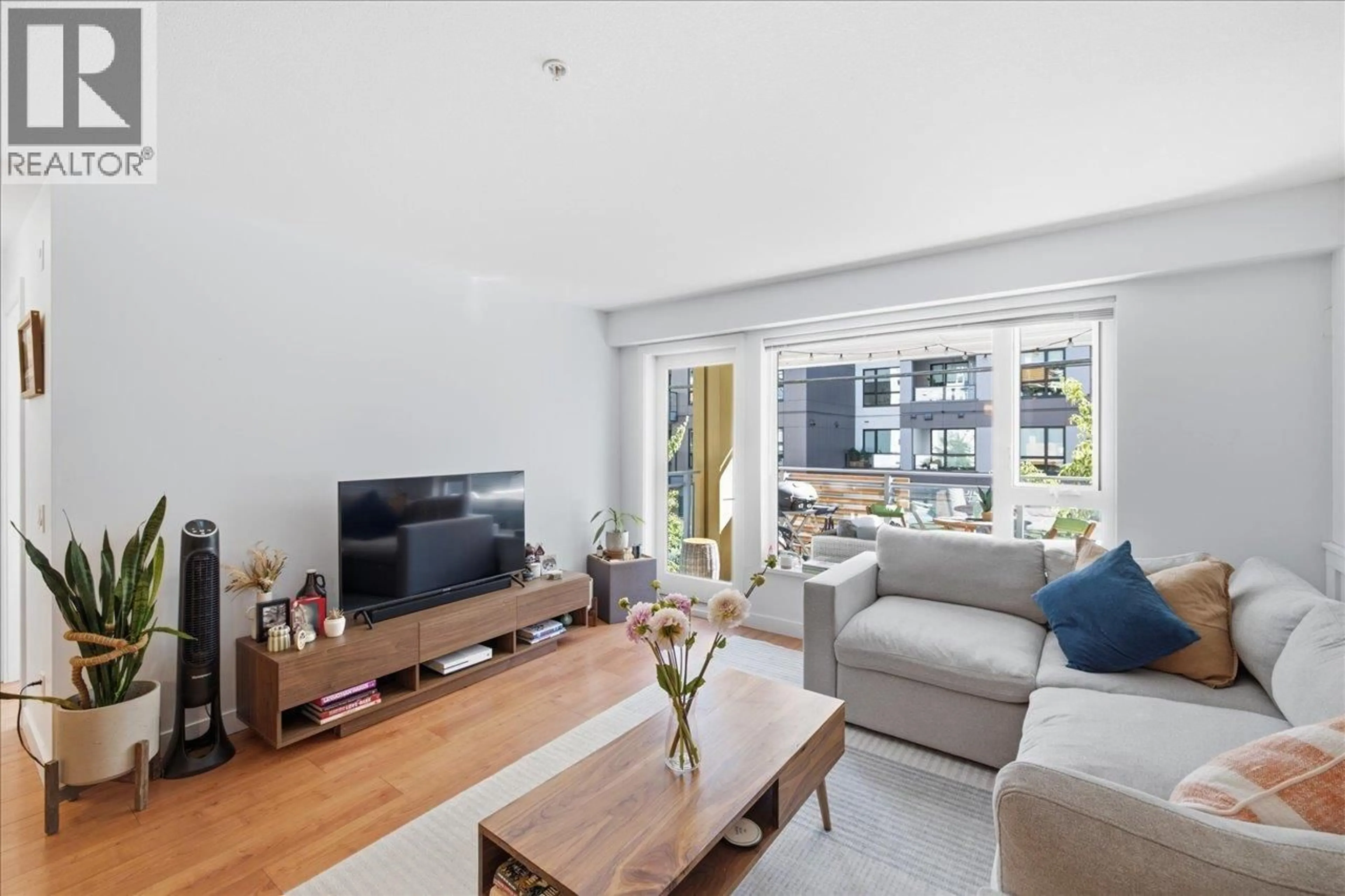 Living room with furniture, unknown for 102 - 221 3RD STREET, North Vancouver British Columbia V7L0C1
