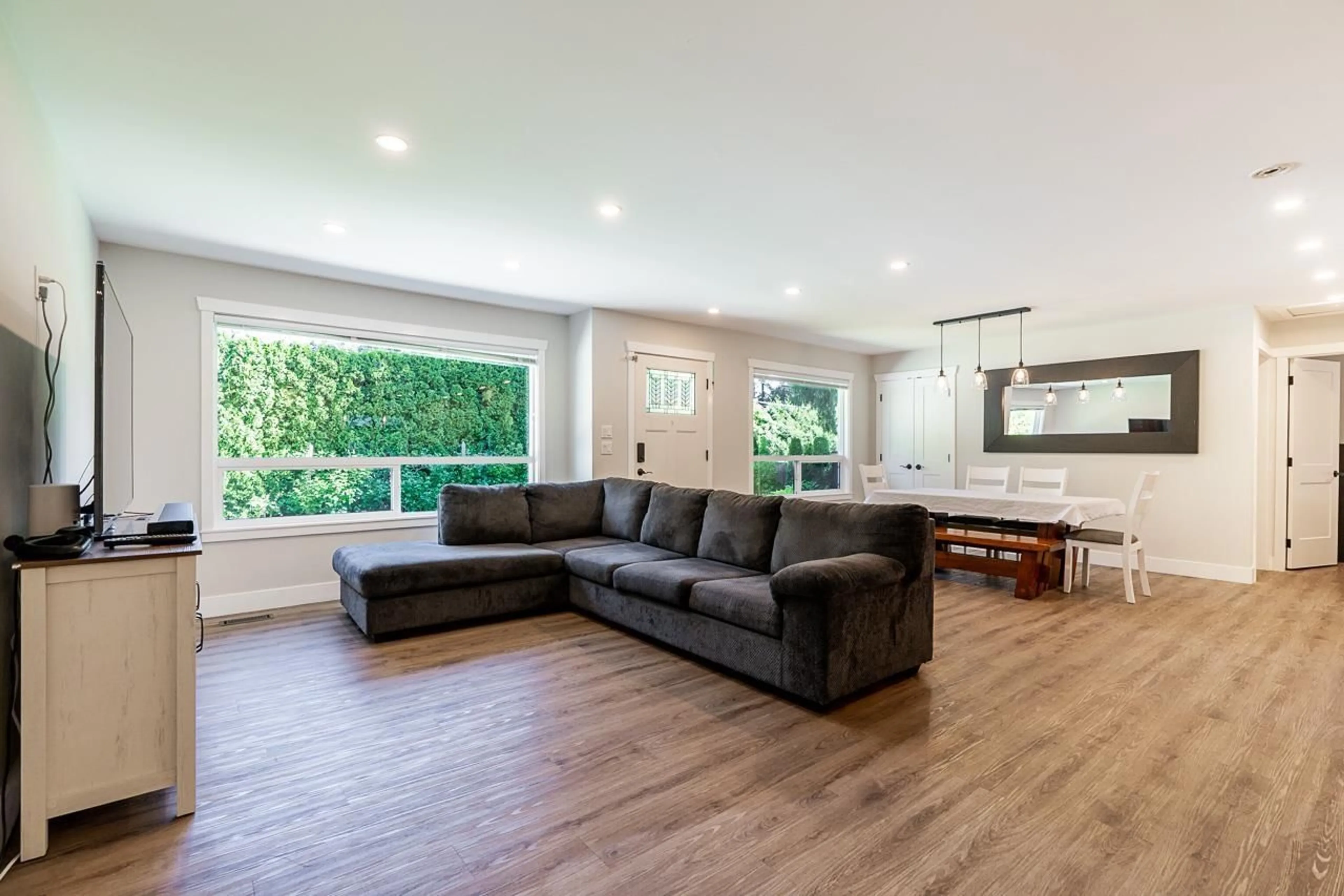 Living room with furniture, wood/laminate floor for 19904 36 AVENUE, Langley British Columbia V3A2R4