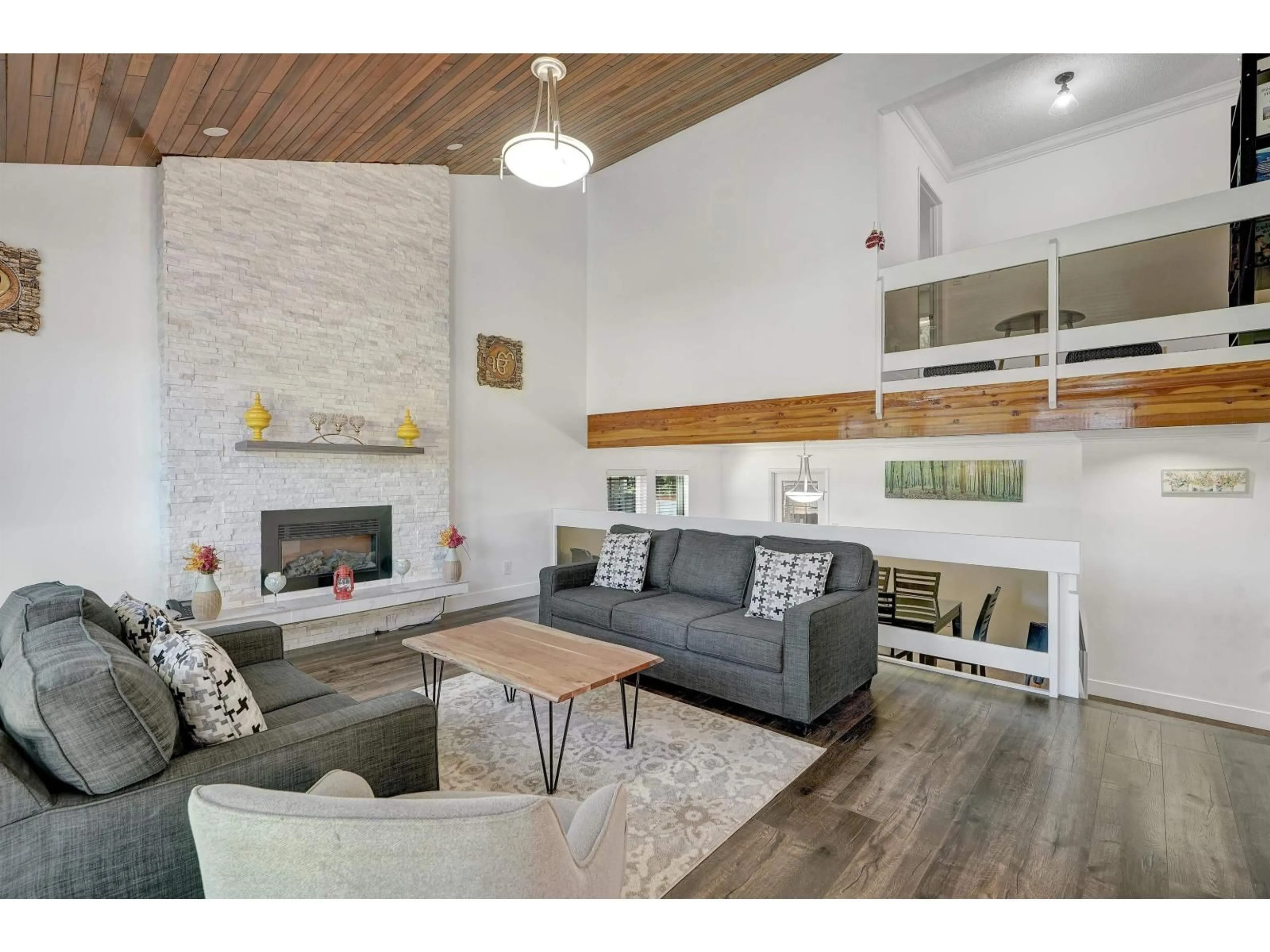 Living room with furniture, wood/laminate floor for 6875 ROCKFORD PLACE, Delta British Columbia V4E2S5