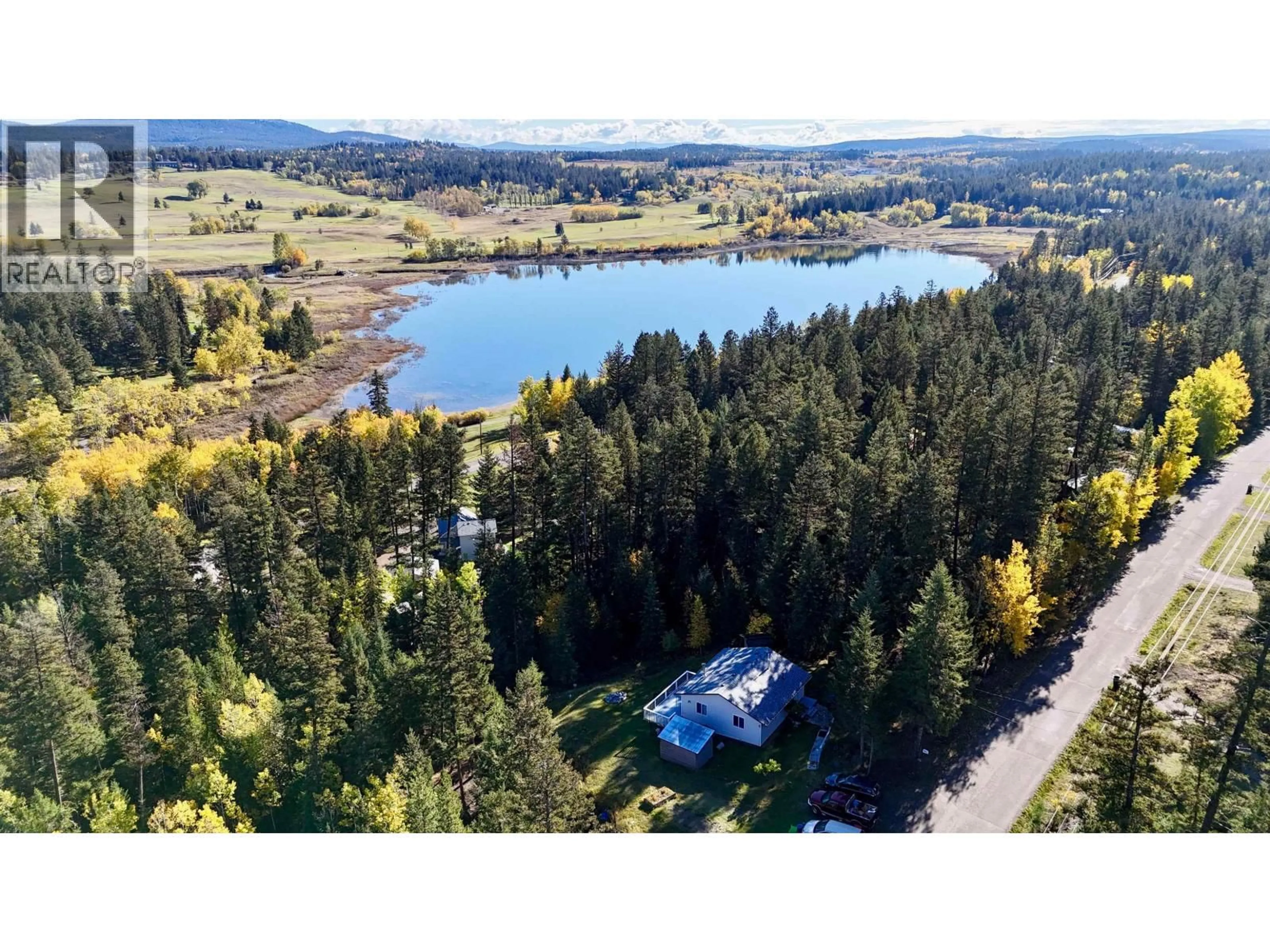 A pic from outside/outdoor area/front of a property/back of a property/a pic from drone, water/lake/river/ocean view for 4871 STEWART ROAD, 100 Mile House British Columbia V0K2Z0