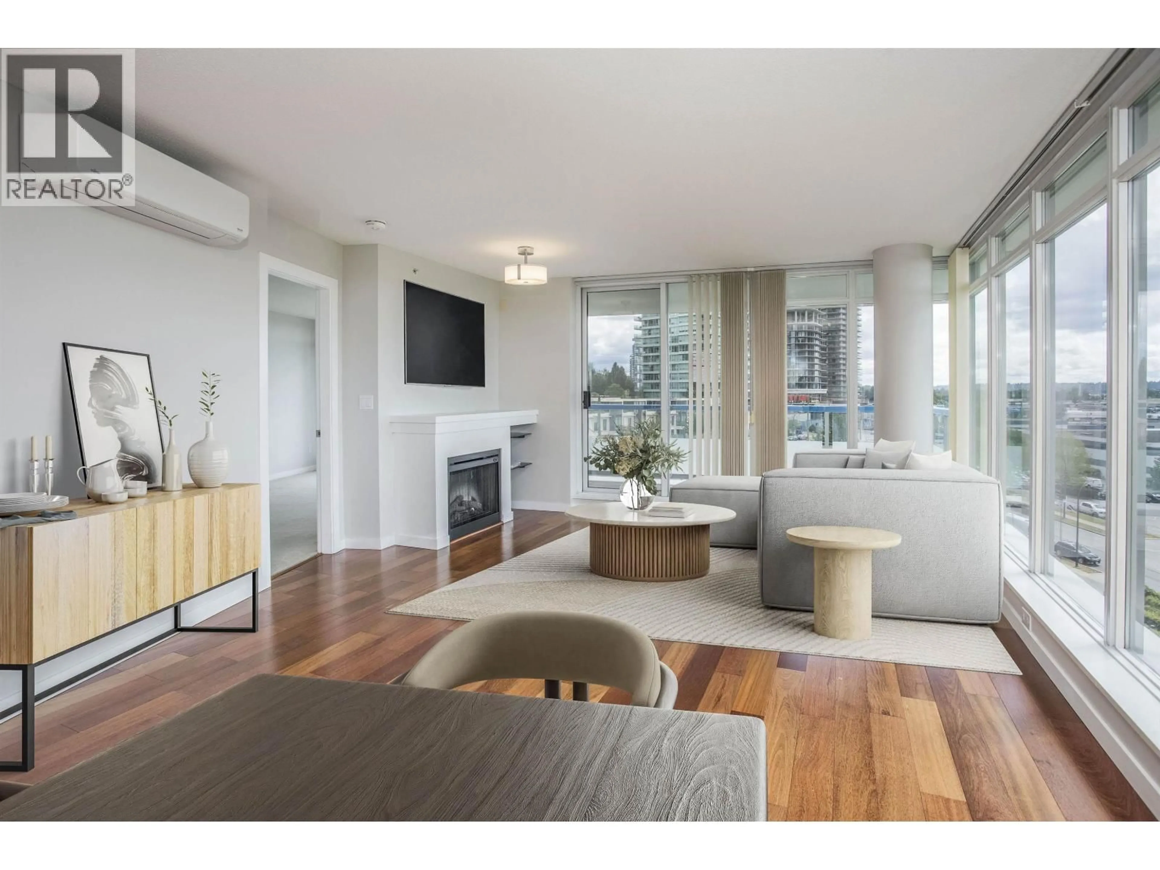Living room with furniture, wood/laminate floor for 507 - 2133 DOUGLAS ROAD, Burnaby British Columbia V5C0E9