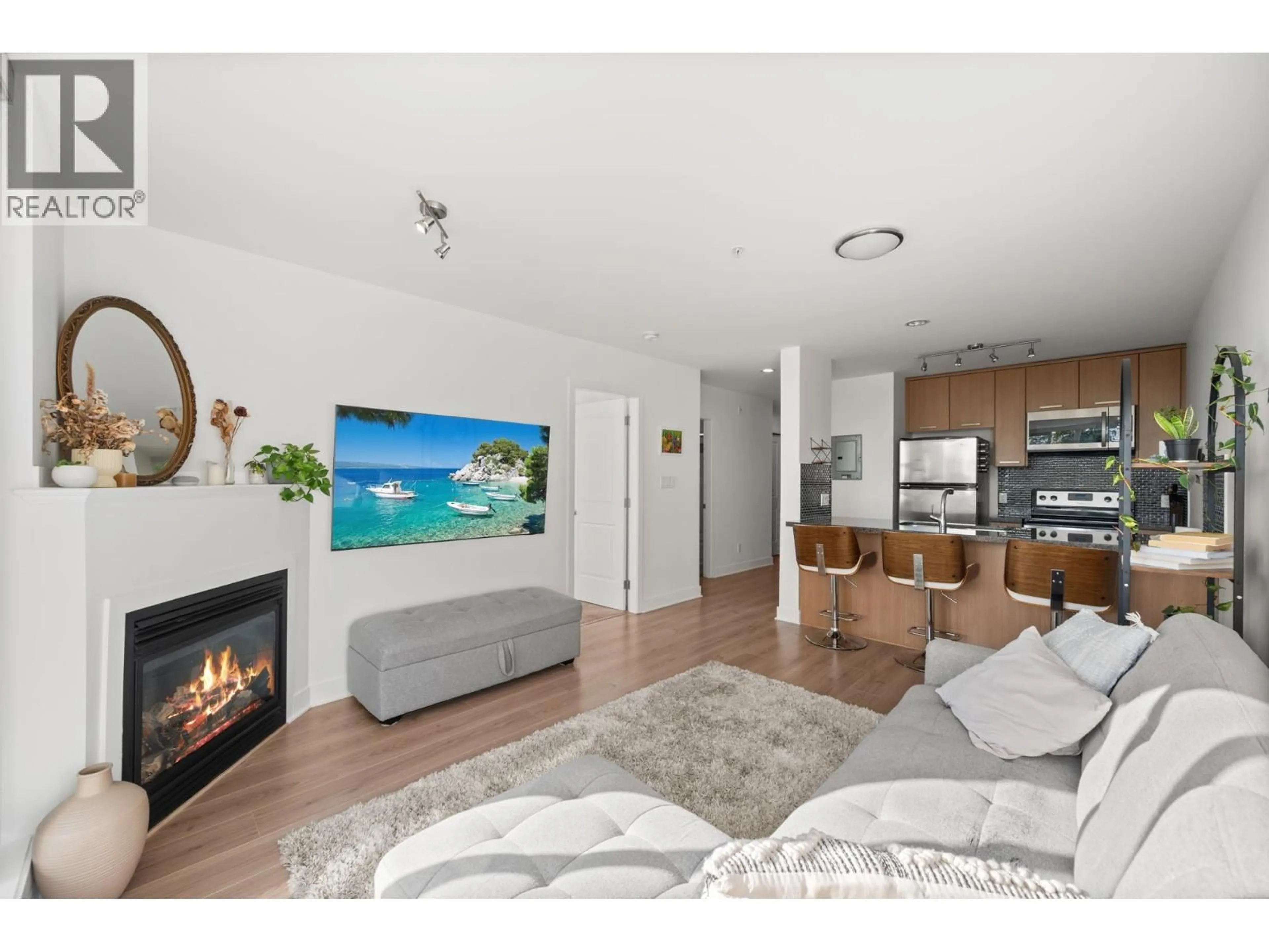 Living room with furniture, wood/laminate floor for 406 - 3255 SMITH AVENUE, Burnaby British Columbia V5G2S9