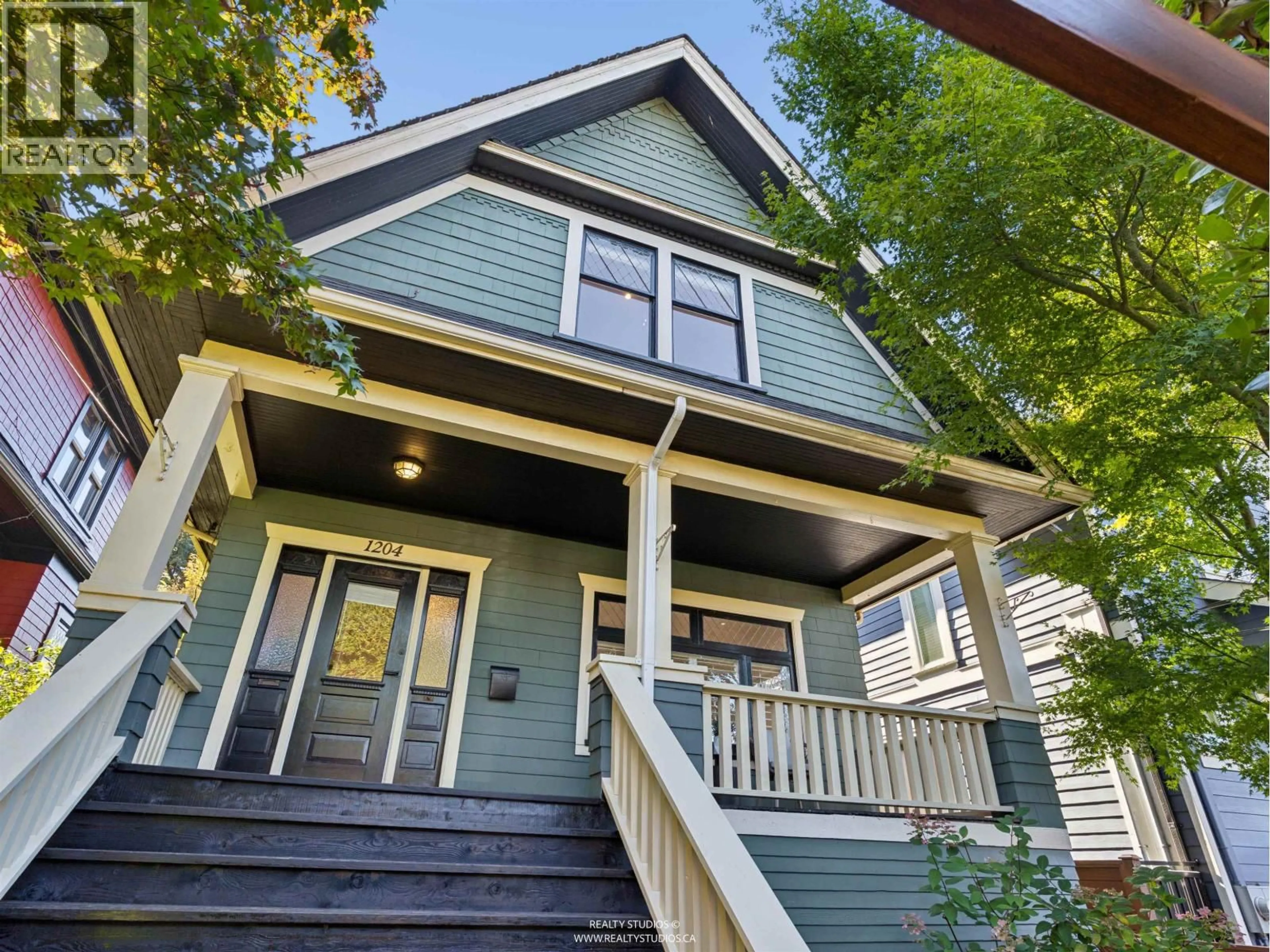 Home with vinyl exterior material, street for 1204 14TH AVENUE, Vancouver British Columbia V5T2P3