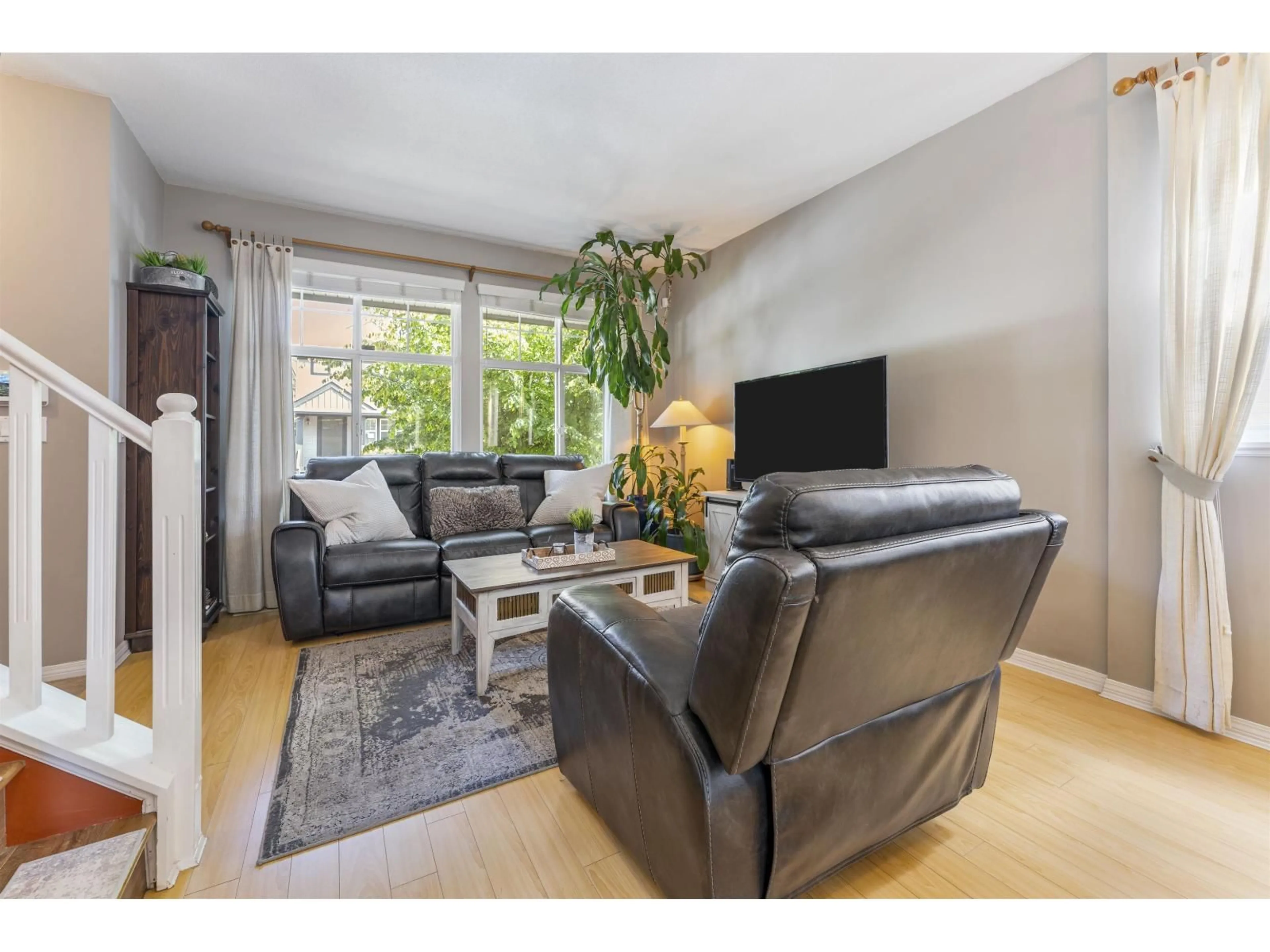 Living room with furniture, wood/laminate floor for 14876 56A AVENUE, Surrey British Columbia V3S8X1