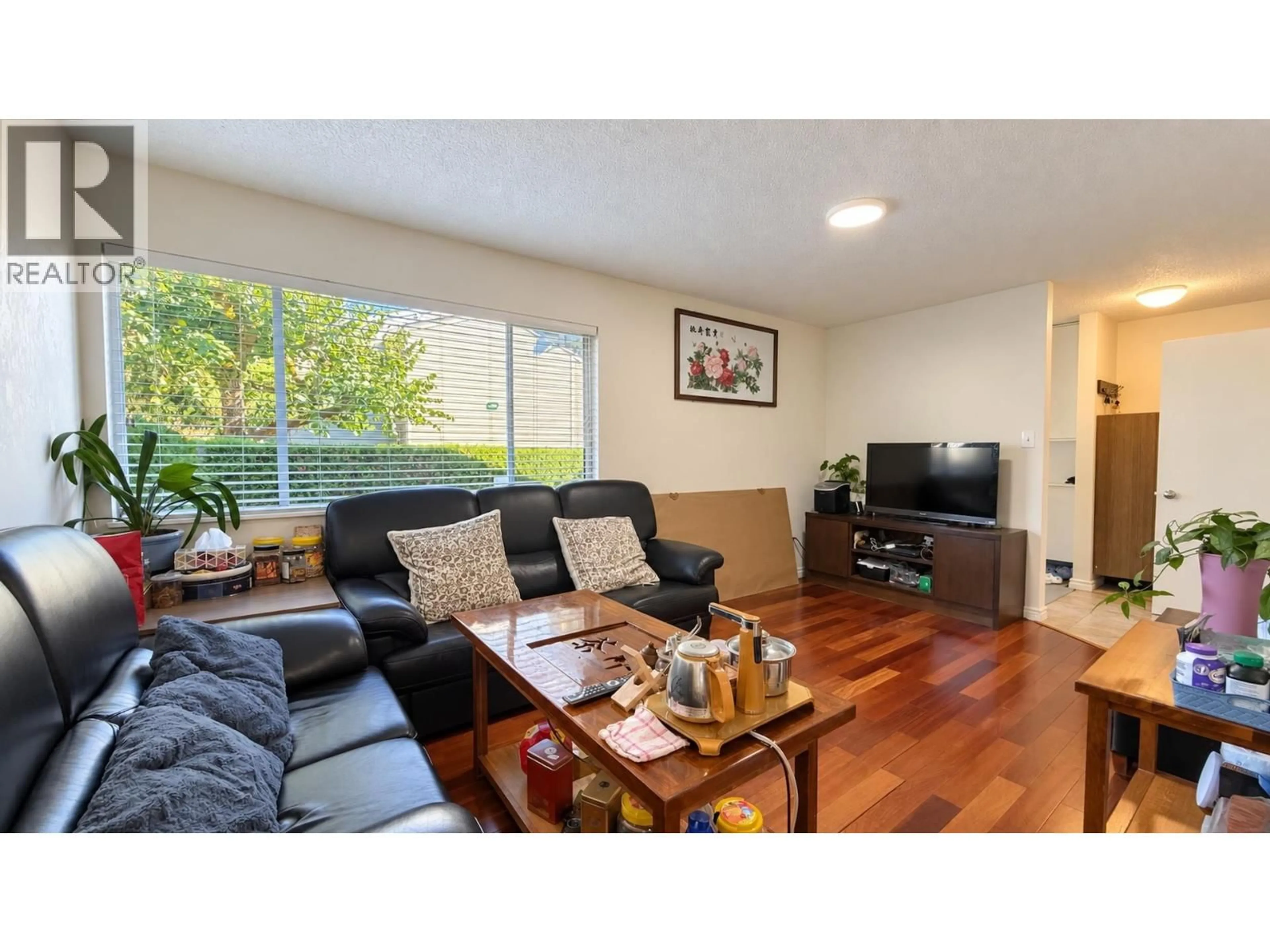 Living room with furniture, wood/laminate floor for 29 - 3417 49TH AVENUE, Vancouver British Columbia V5S1M1