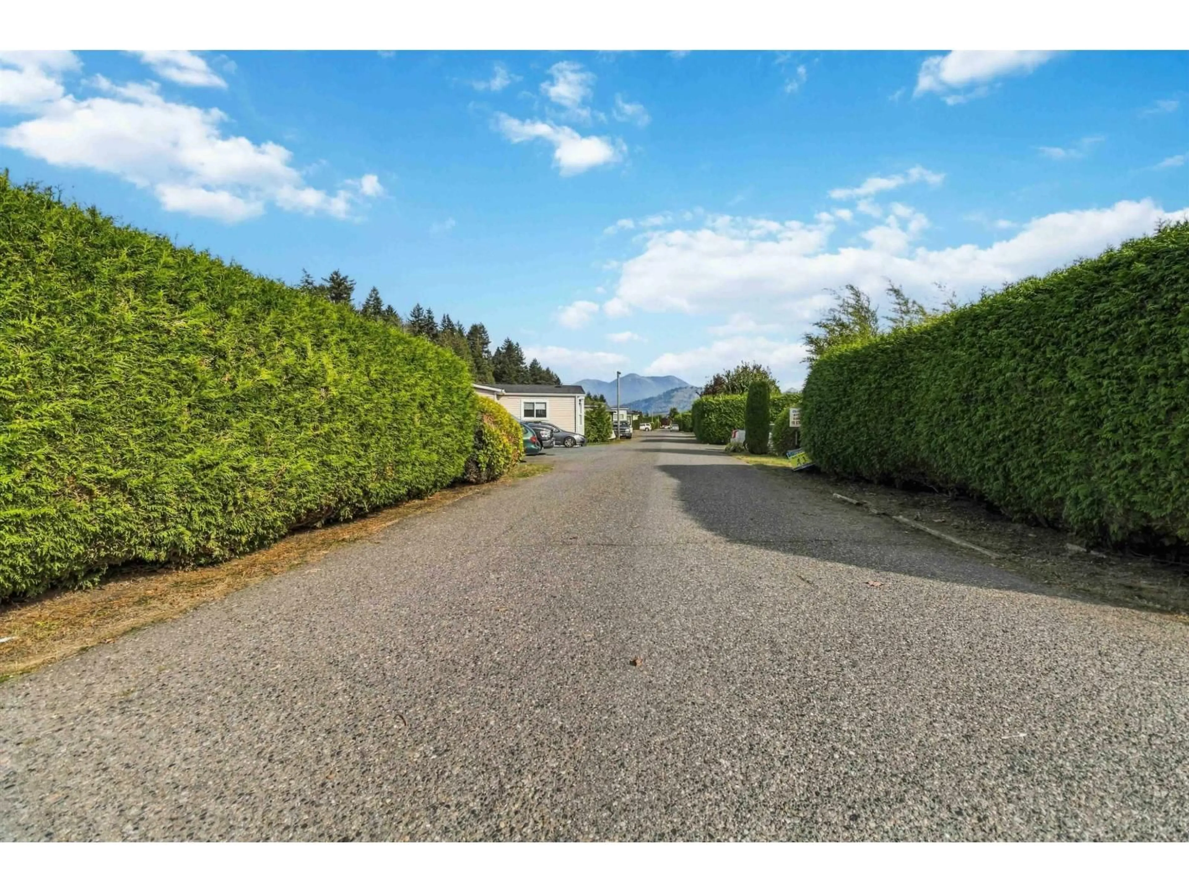 A pic from outside/outdoor area/front of a property/back of a property/a pic from drone, street for 74 - 5742 UNSWORTH ROAD, Chilliwack British Columbia V2R3A2