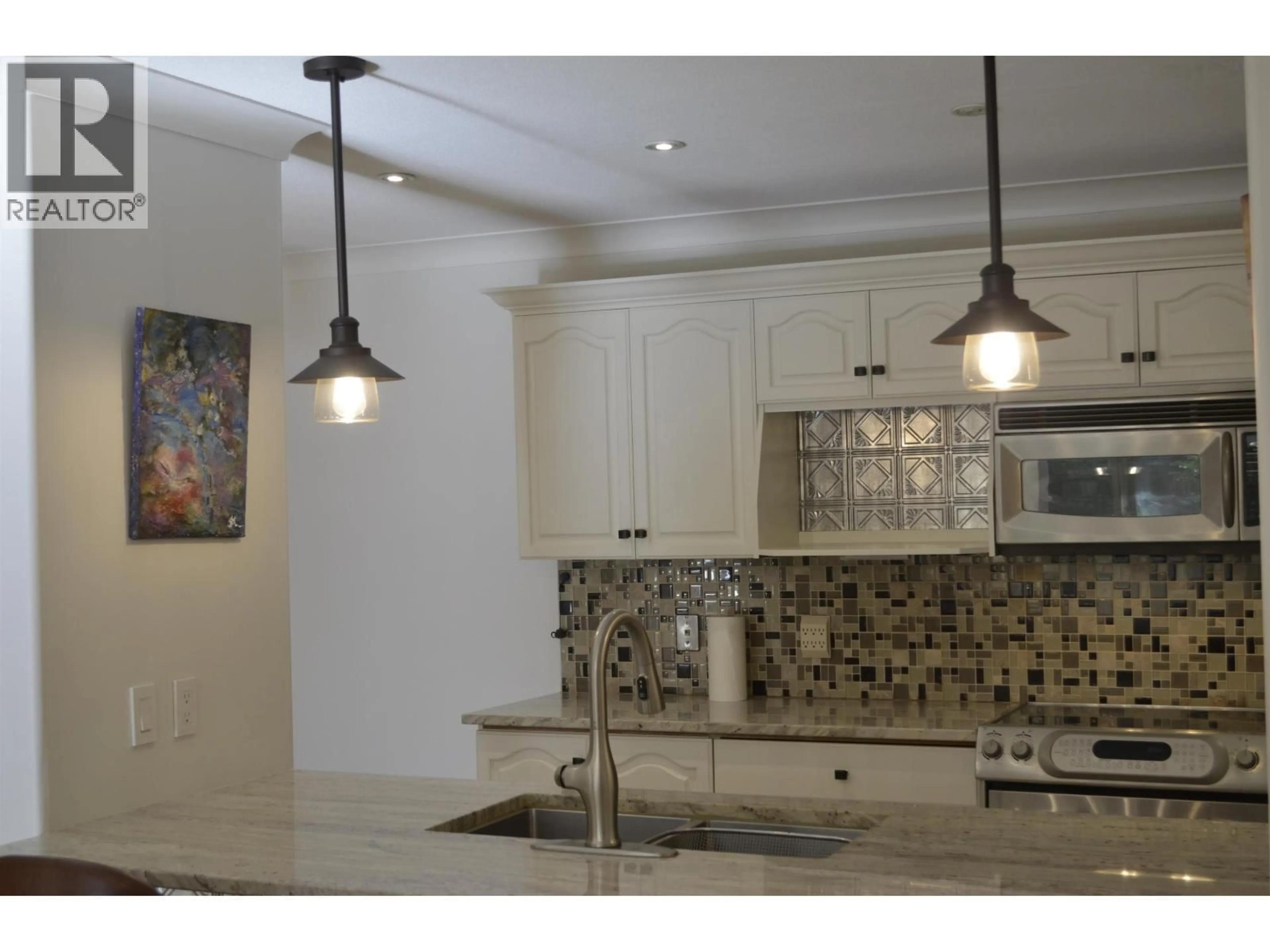 Open concept kitchen, ceramic/tile floor for 110 - 3176 PLATEAU BOULEVARD, Coquitlam British Columbia V3E3J2