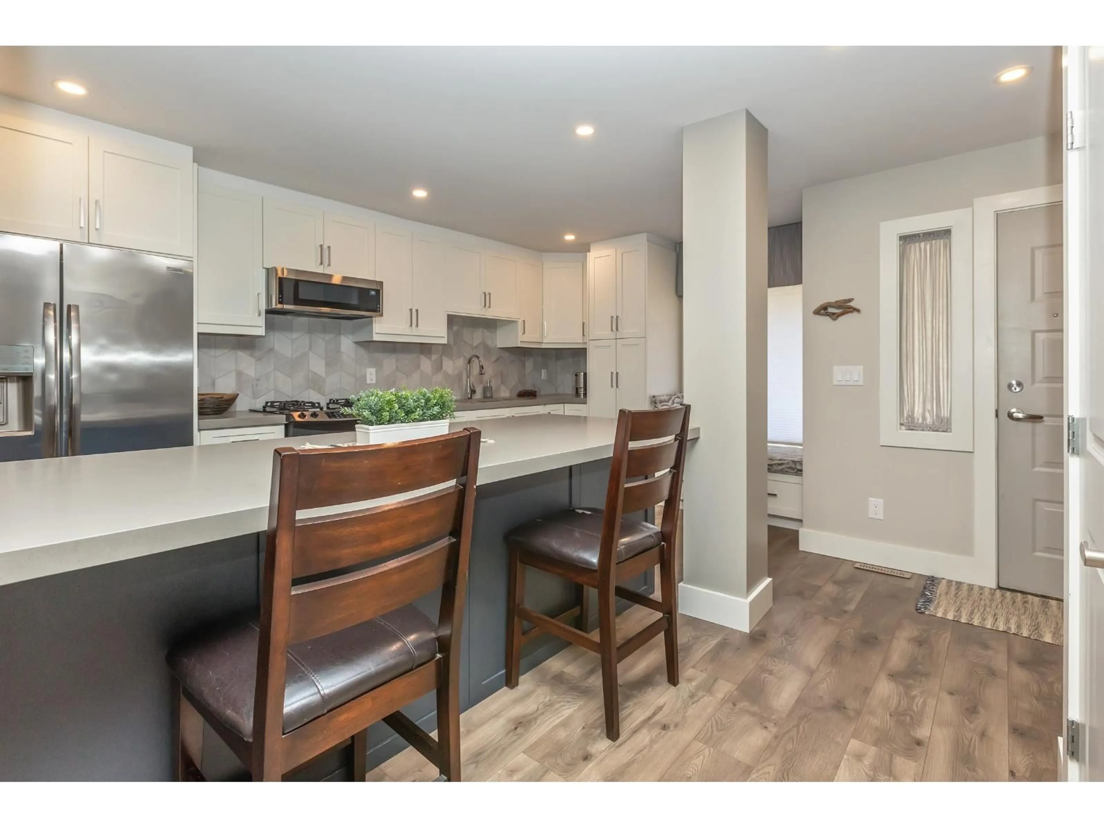 Open concept kitchen, wood/laminate floor for 15804 MCBETH ROAD, Surrey British Columbia V4A5X3