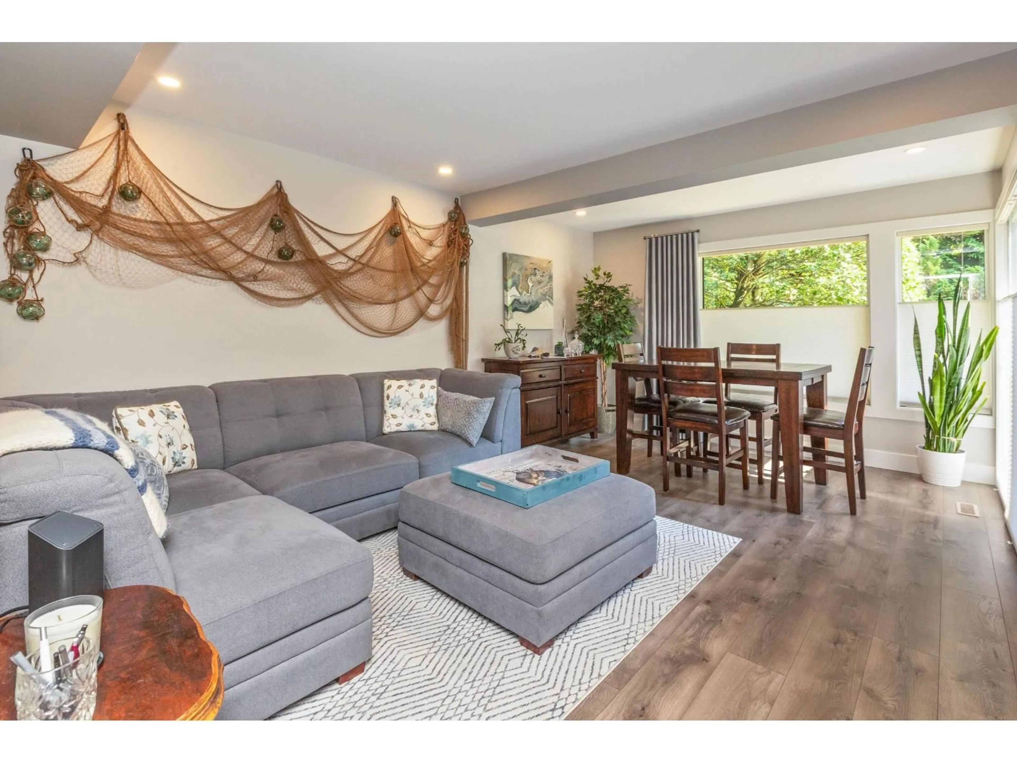 Living room with furniture, wood/laminate floor for 15804 MCBETH ROAD, Surrey British Columbia V4A5X3
