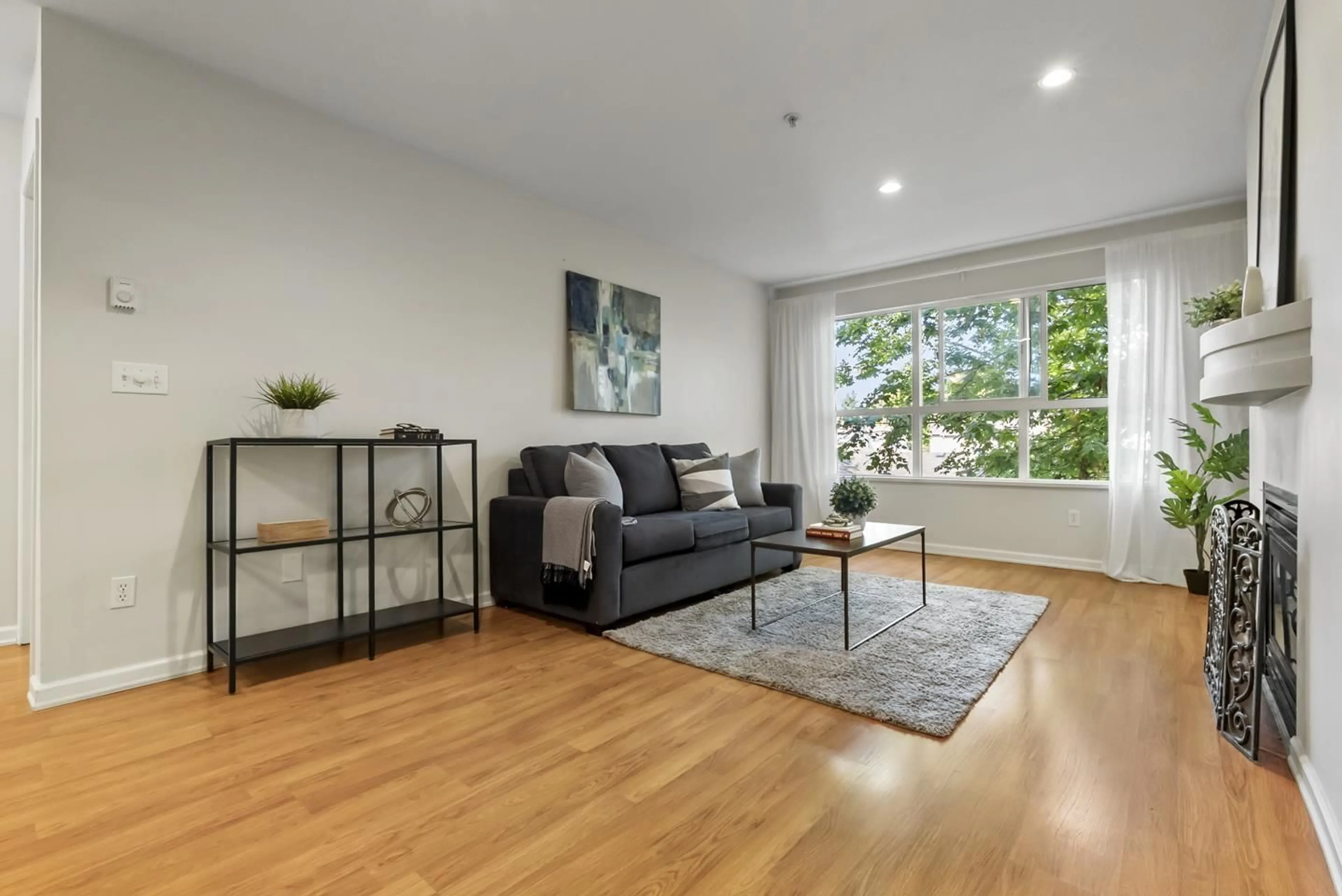 Living room with furniture, wood/laminate floor for 311 - 10188 155 STREET, Surrey British Columbia V3R0R6