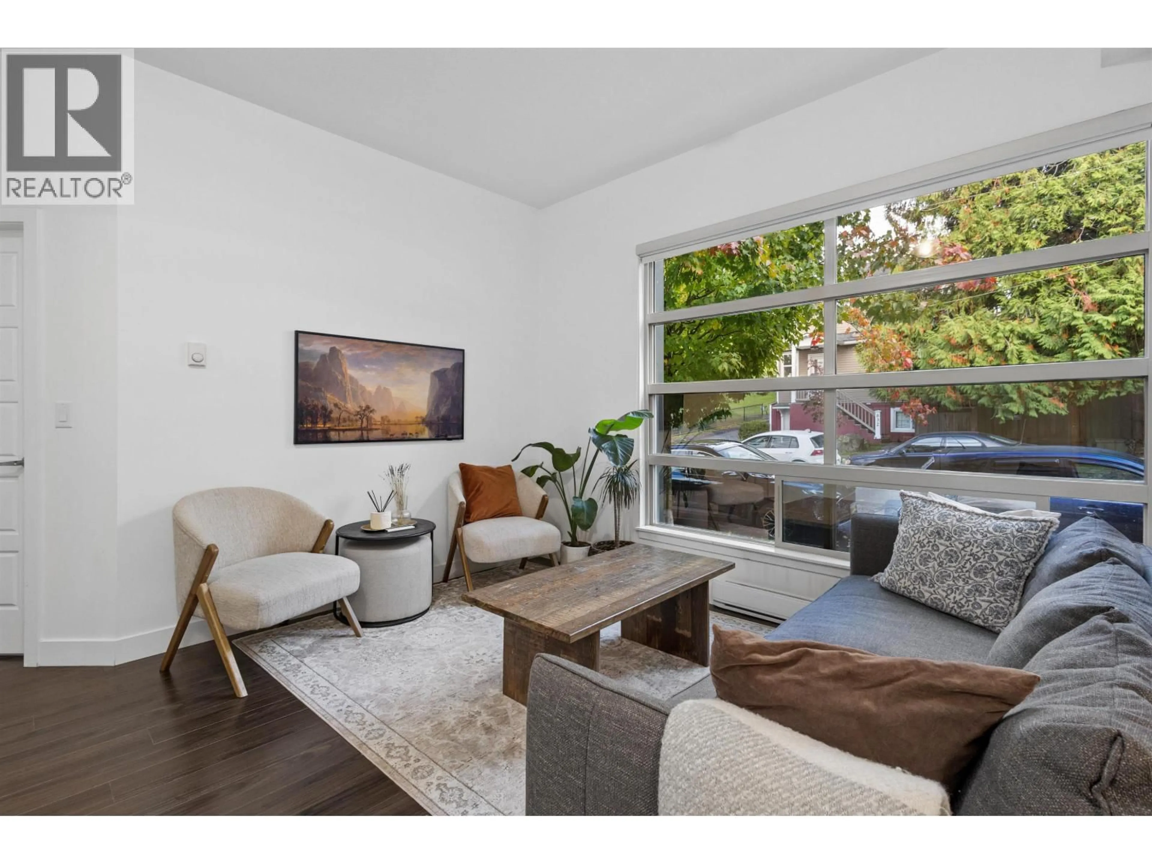 Living room with furniture, wood/laminate floor for 881 SALSBURY DRIVE, Vancouver British Columbia V5L4A3