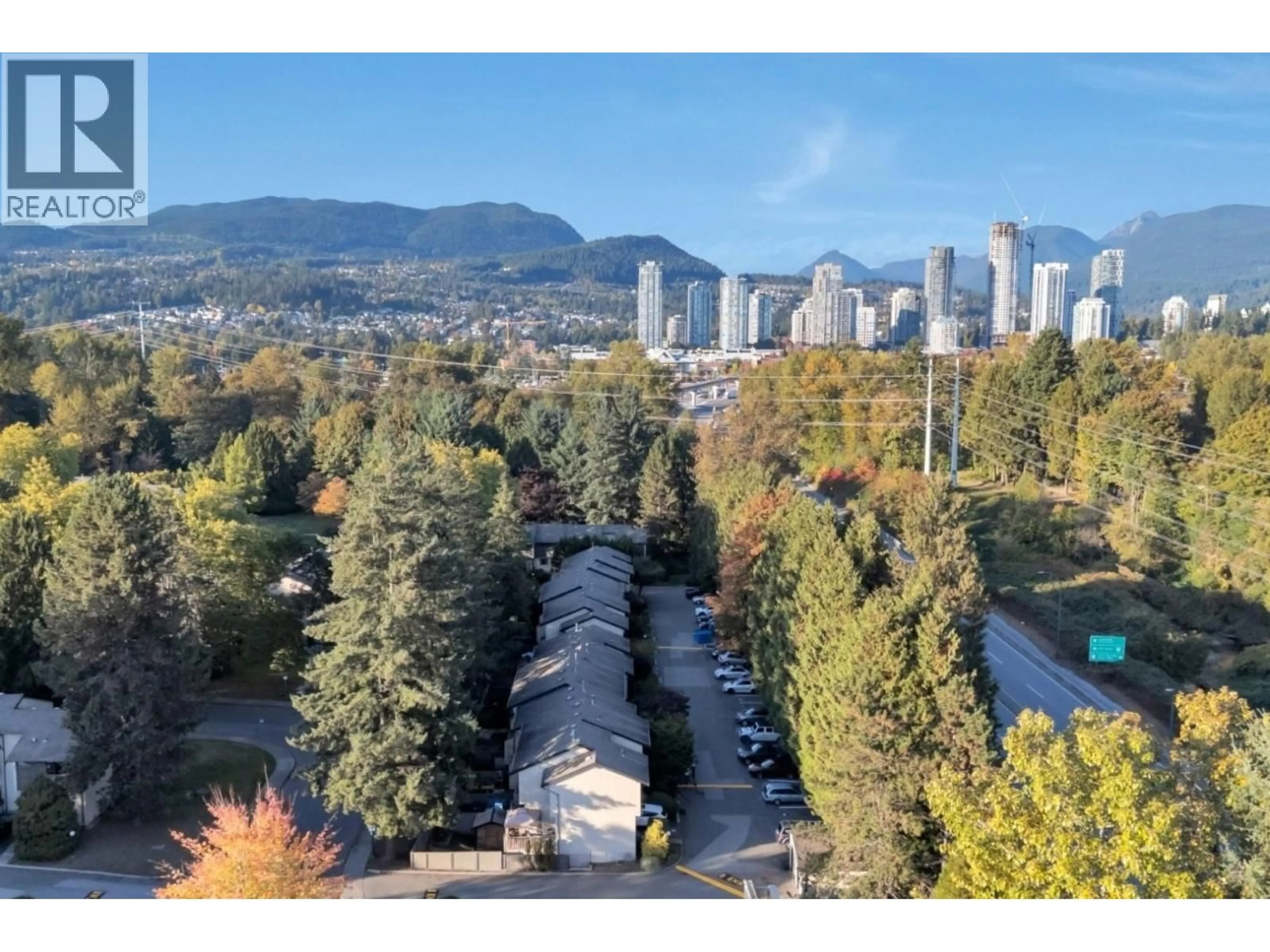 A pic from outside/outdoor area/front of a property/back of a property/a pic from drone, mountain view for 102 - 2915 NORMAN AVENUE, Coquitlam British Columbia V3C4H8