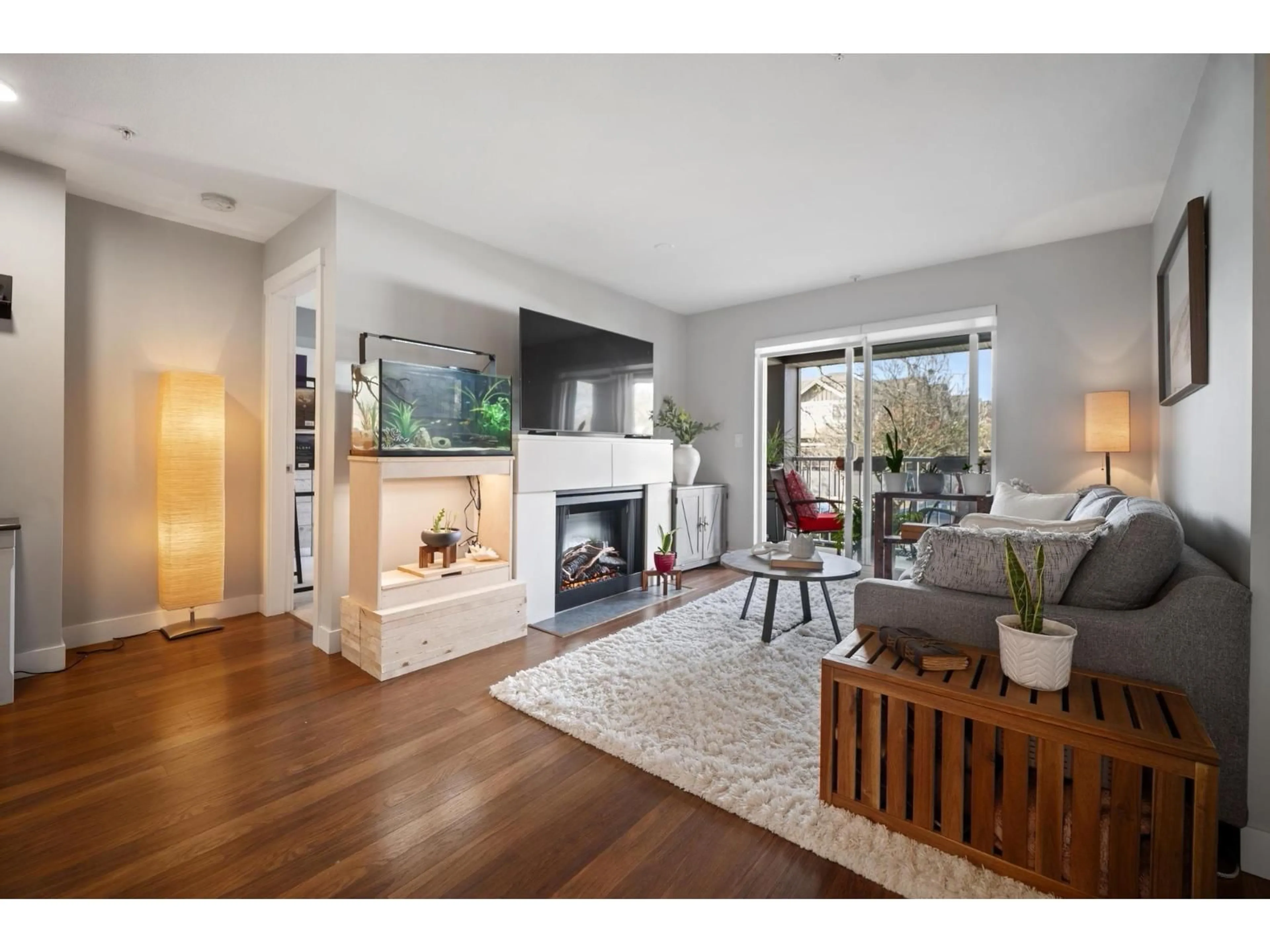 Living room with furniture, wood/laminate floor for 210 - 19320 65 AVENUE, Surrey British Columbia V4N0A3