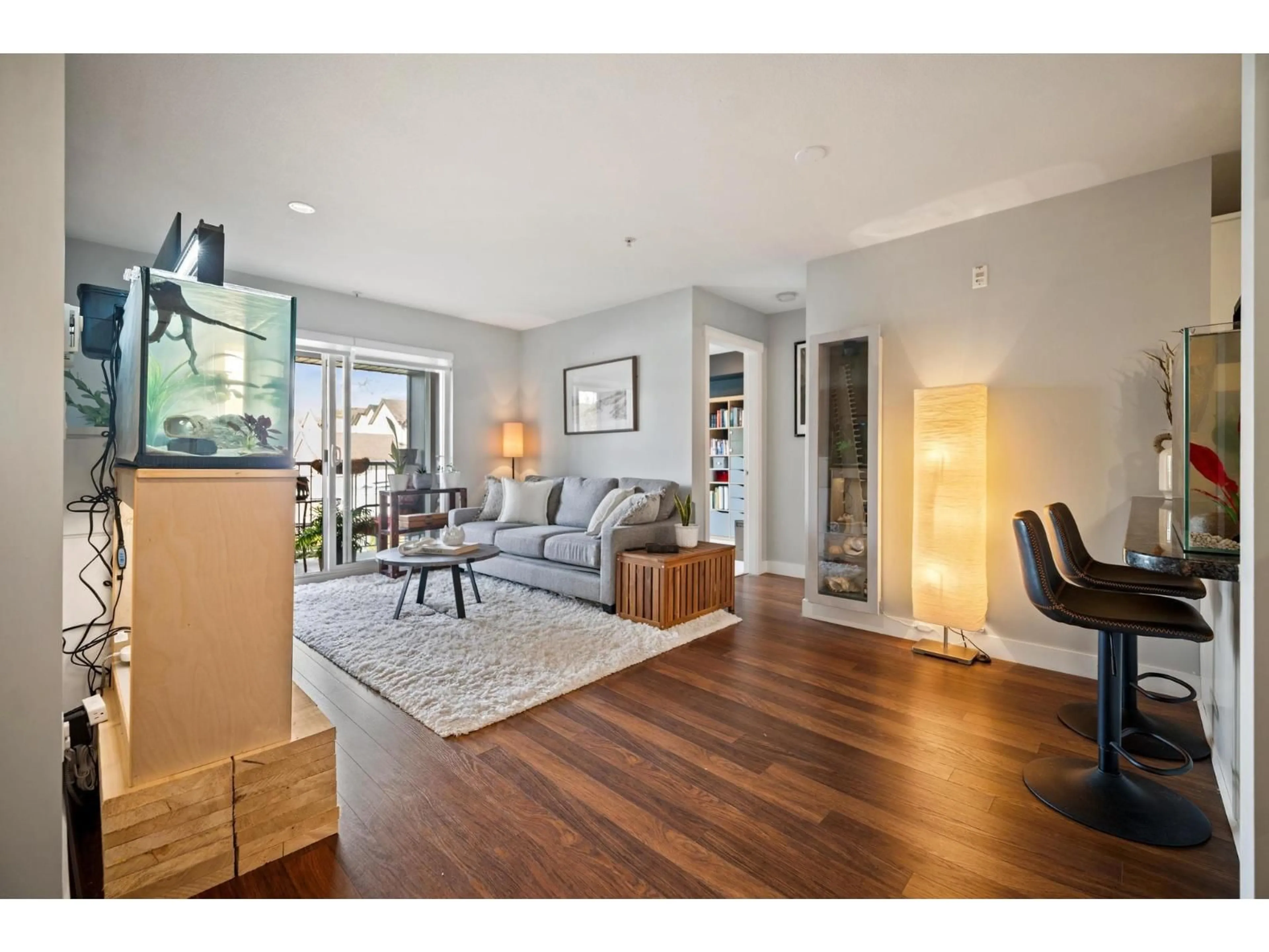 Living room with furniture, wood/laminate floor for 210 - 19320 65 AVENUE, Surrey British Columbia V4N0A3