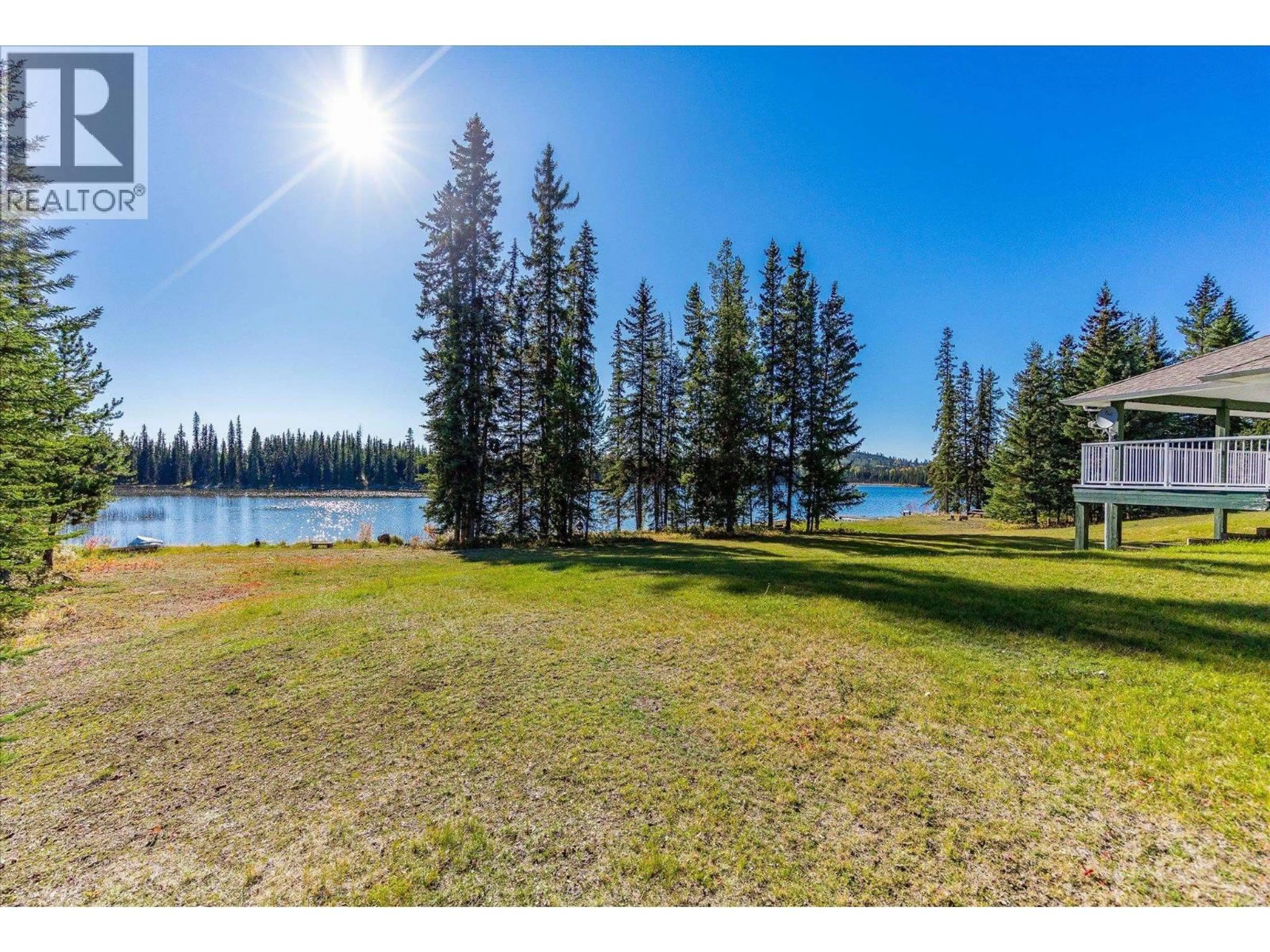 A pic from outside/outdoor area/front of a property/back of a property/a pic from drone, water/lake/river/ocean view for 6782 EDMUNDS LAKE ROAD, 100 Mile House British Columbia V0K2E2