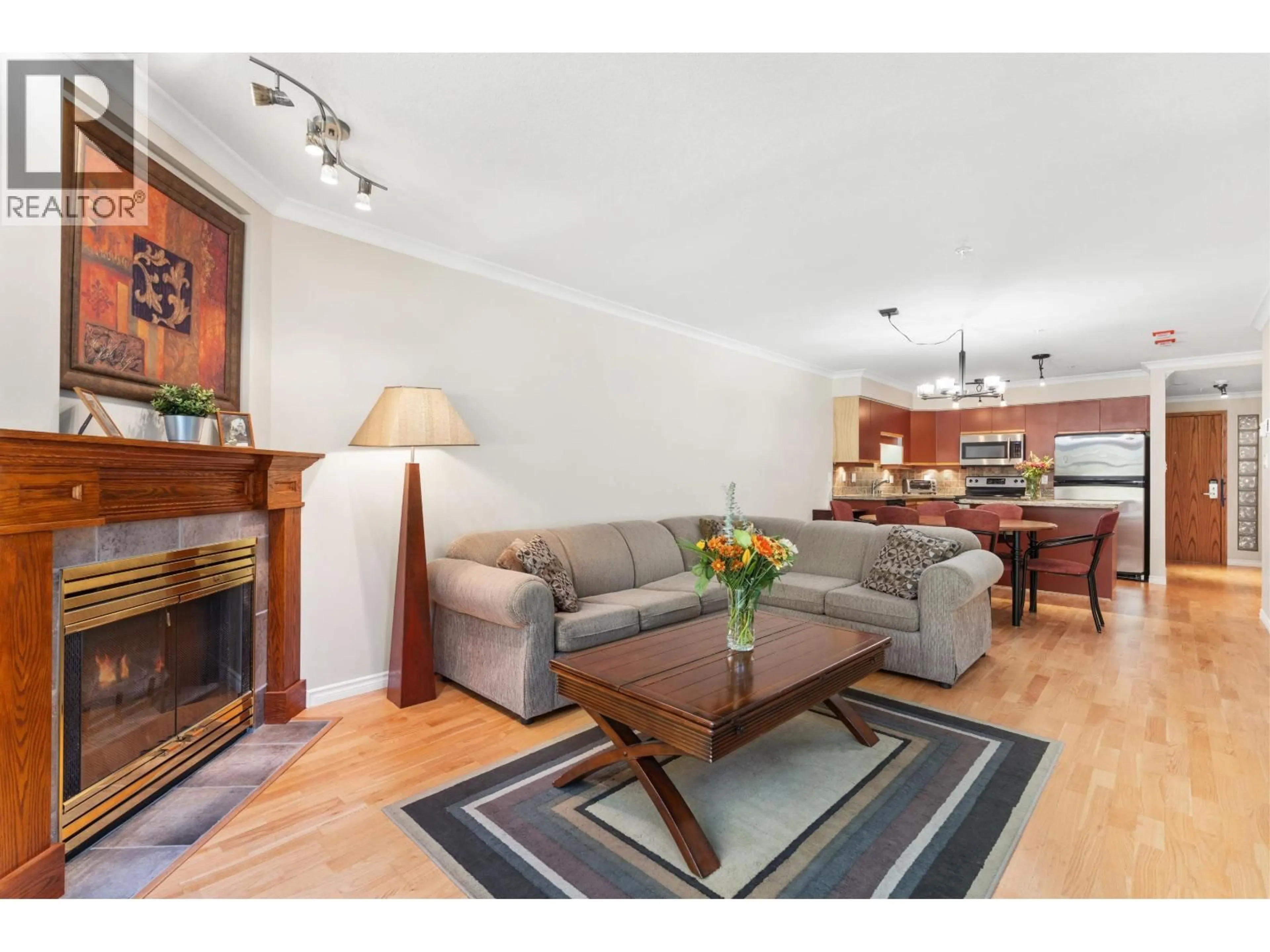 Living room with furniture, wood/laminate floor for 206 - 3212 BLUEBERRY DRIVE, Whistler British Columbia V8E0T5