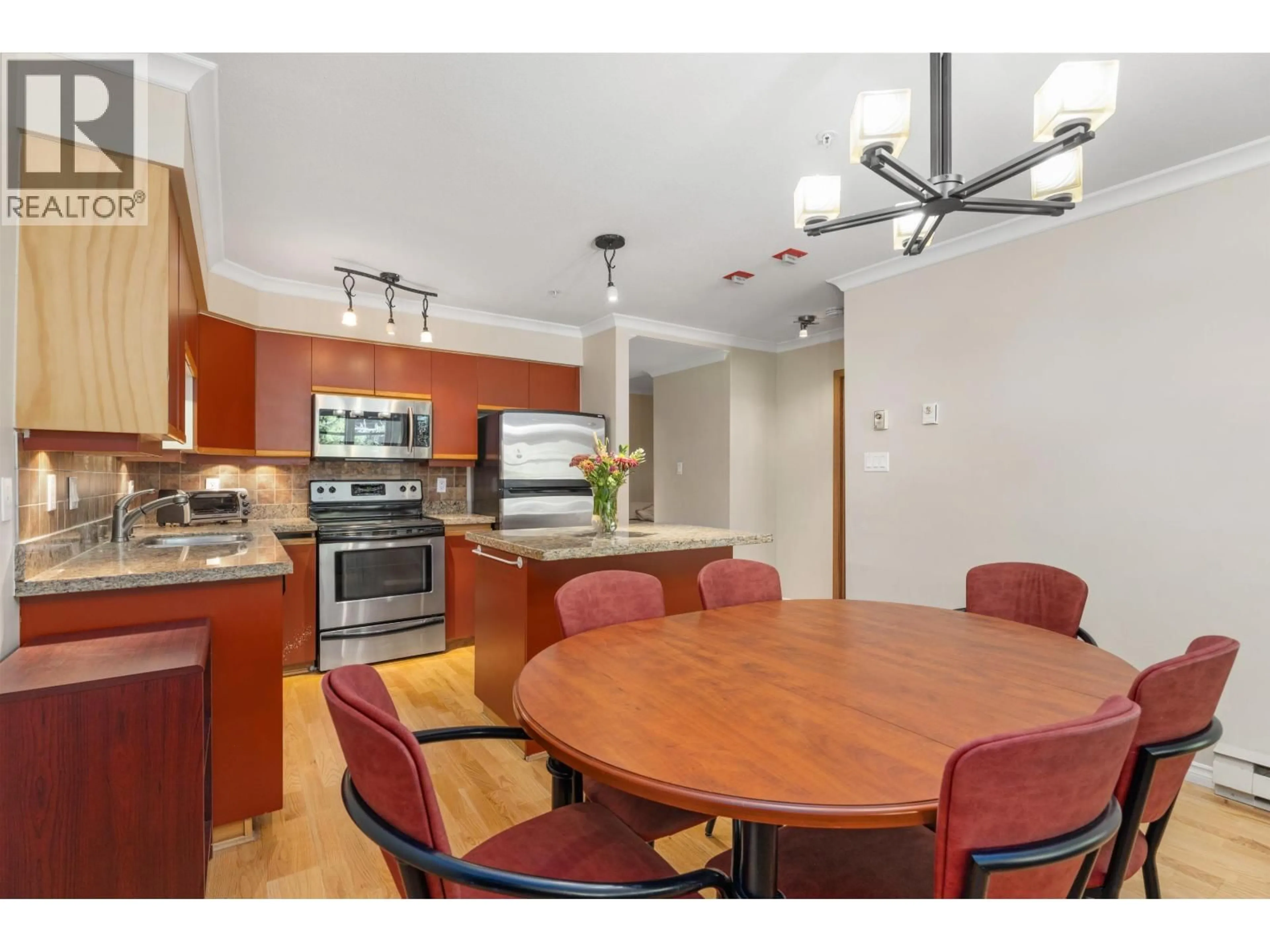Open concept kitchen, wood/laminate floor for 206 - 3212 BLUEBERRY DRIVE, Whistler British Columbia V8E0T5