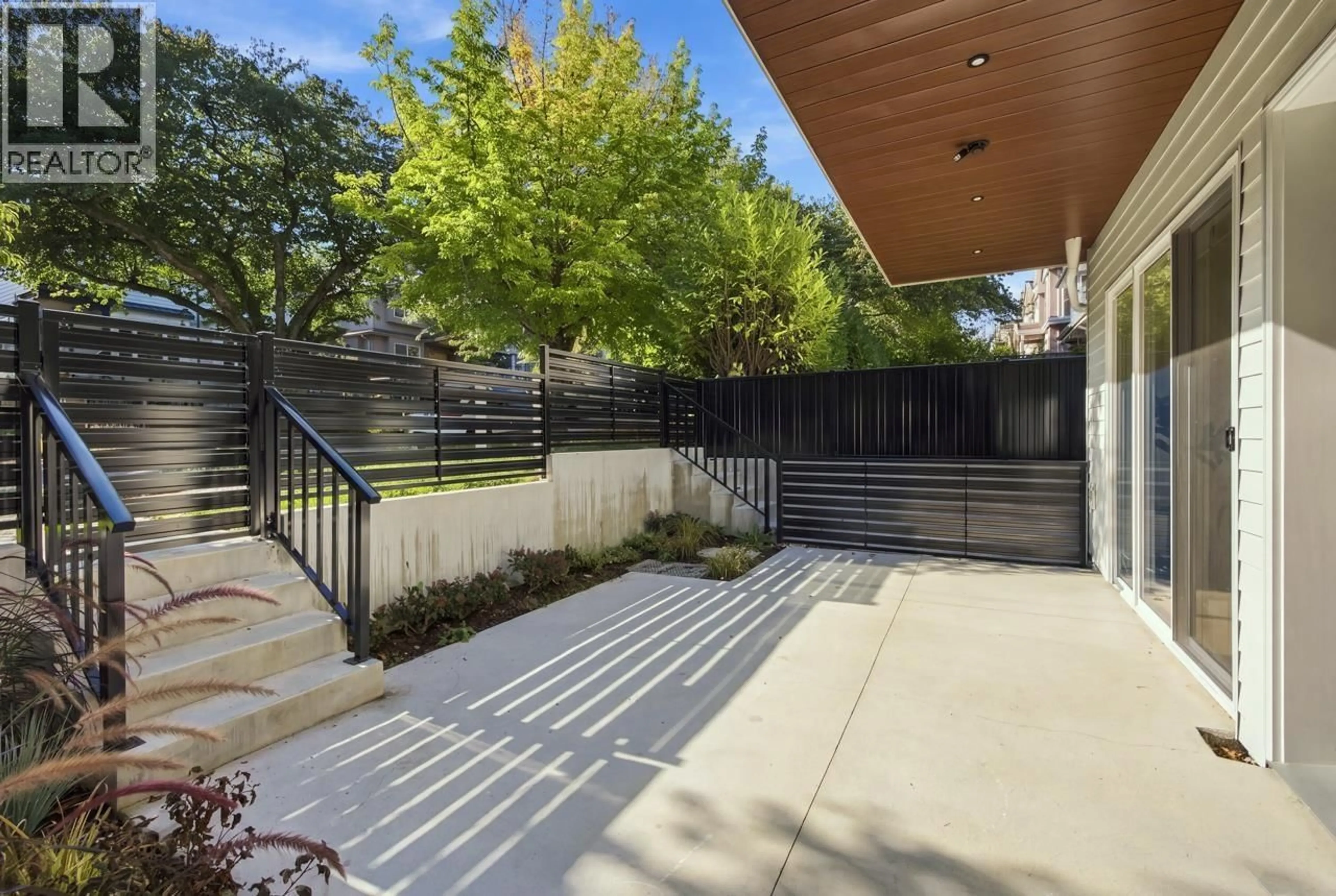 Patio, street for 1 - 3185 GRAVELEY STREET, Vancouver British Columbia V5K3K7