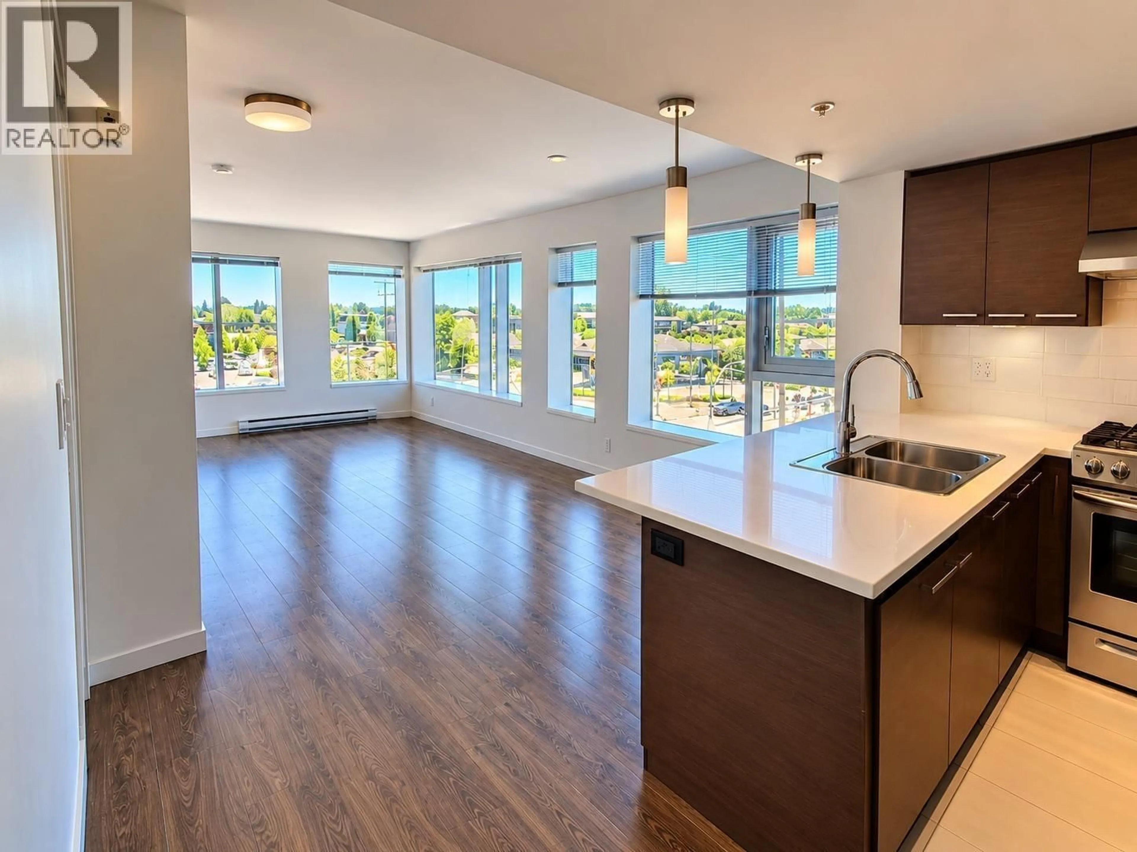 Open concept kitchen, wood/laminate floor for 327 - 10880 NO. 5 ROAD, Richmond British Columbia V6W0B3