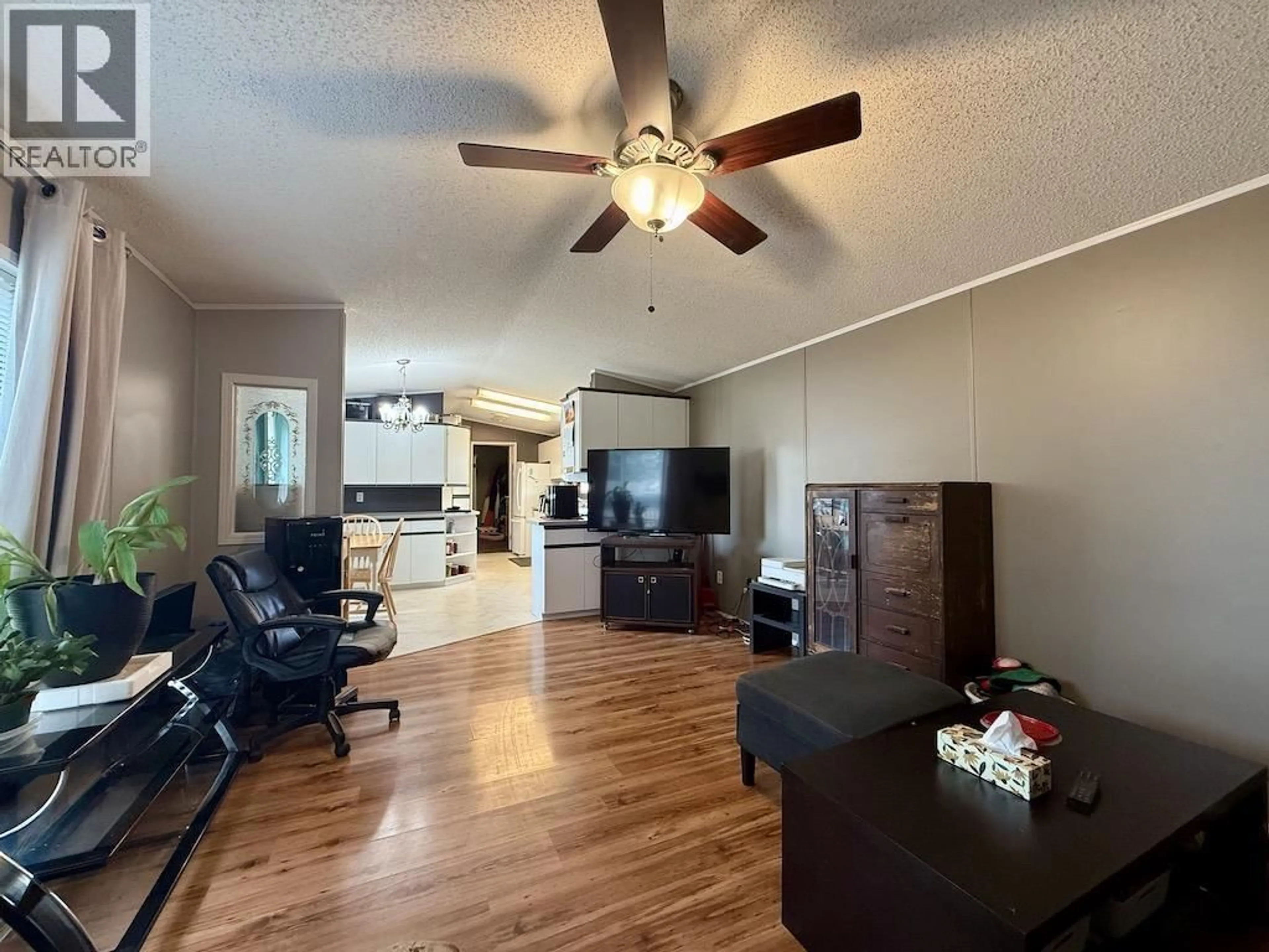 Living room with furniture, wood/laminate floor for 23 - 8420 ALASKA ROAD, Fort St. John British Columbia V1J4J6
