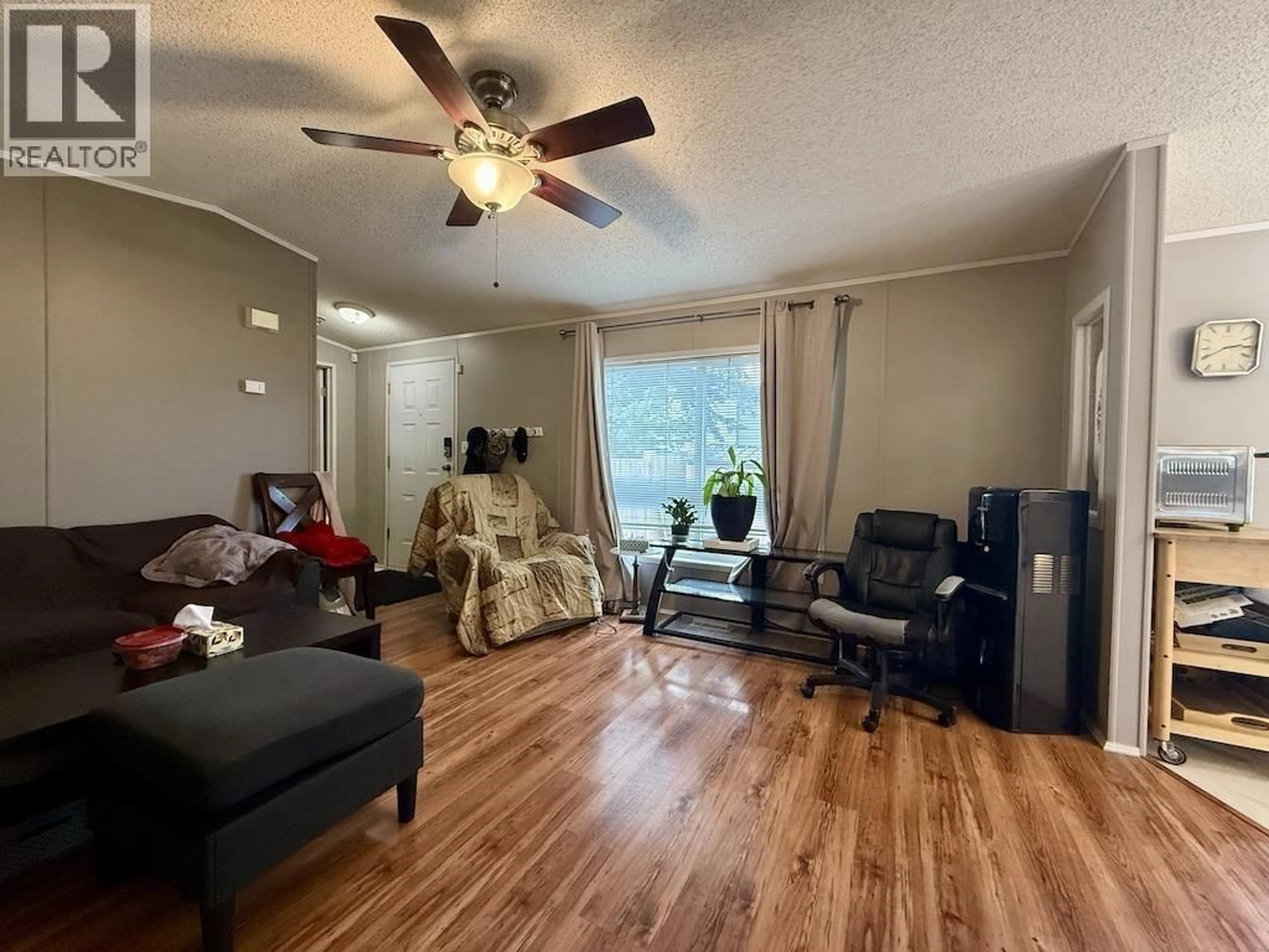 Living room with furniture, wood/laminate floor for 23 - 8420 ALASKA ROAD, Fort St. John British Columbia V1J4J6