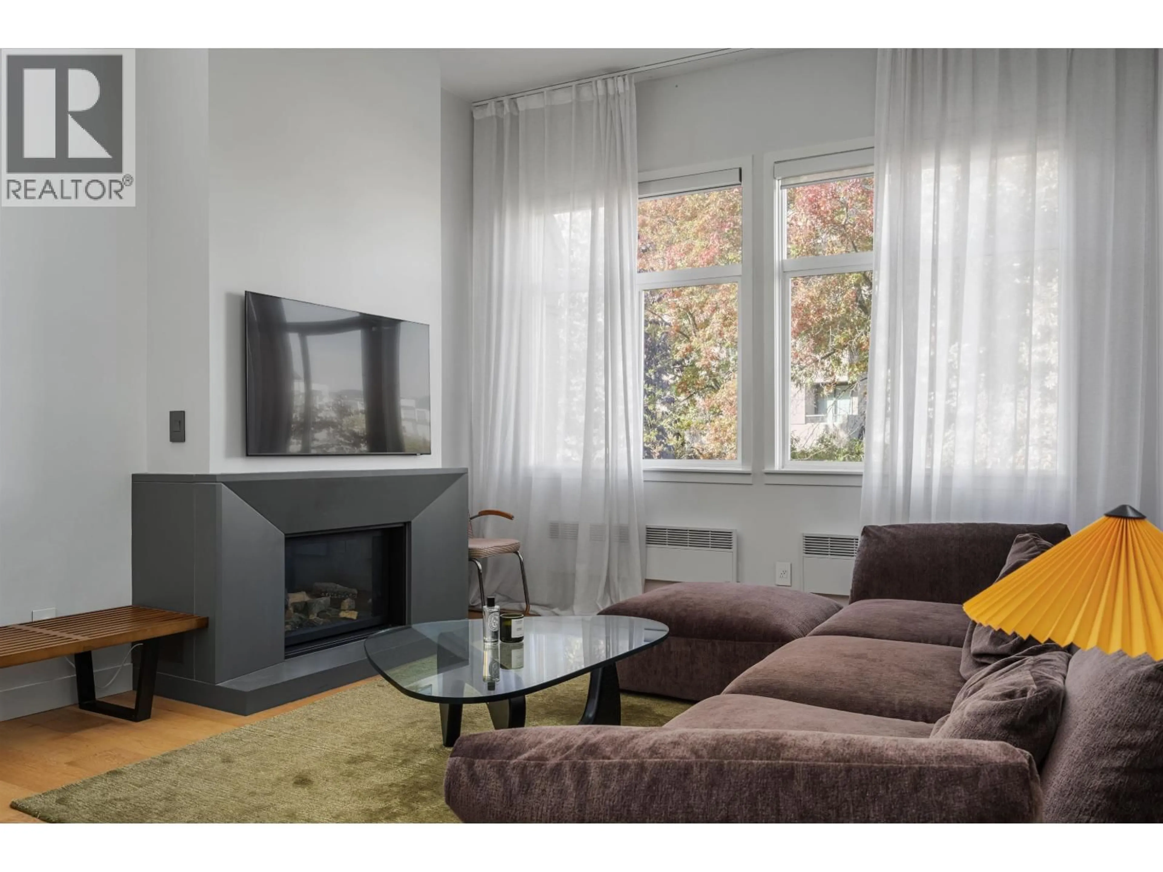 Living room with furniture, wood/laminate floor for 302 - 650 MOBERLY ROAD, Vancouver British Columbia V5Z4J1