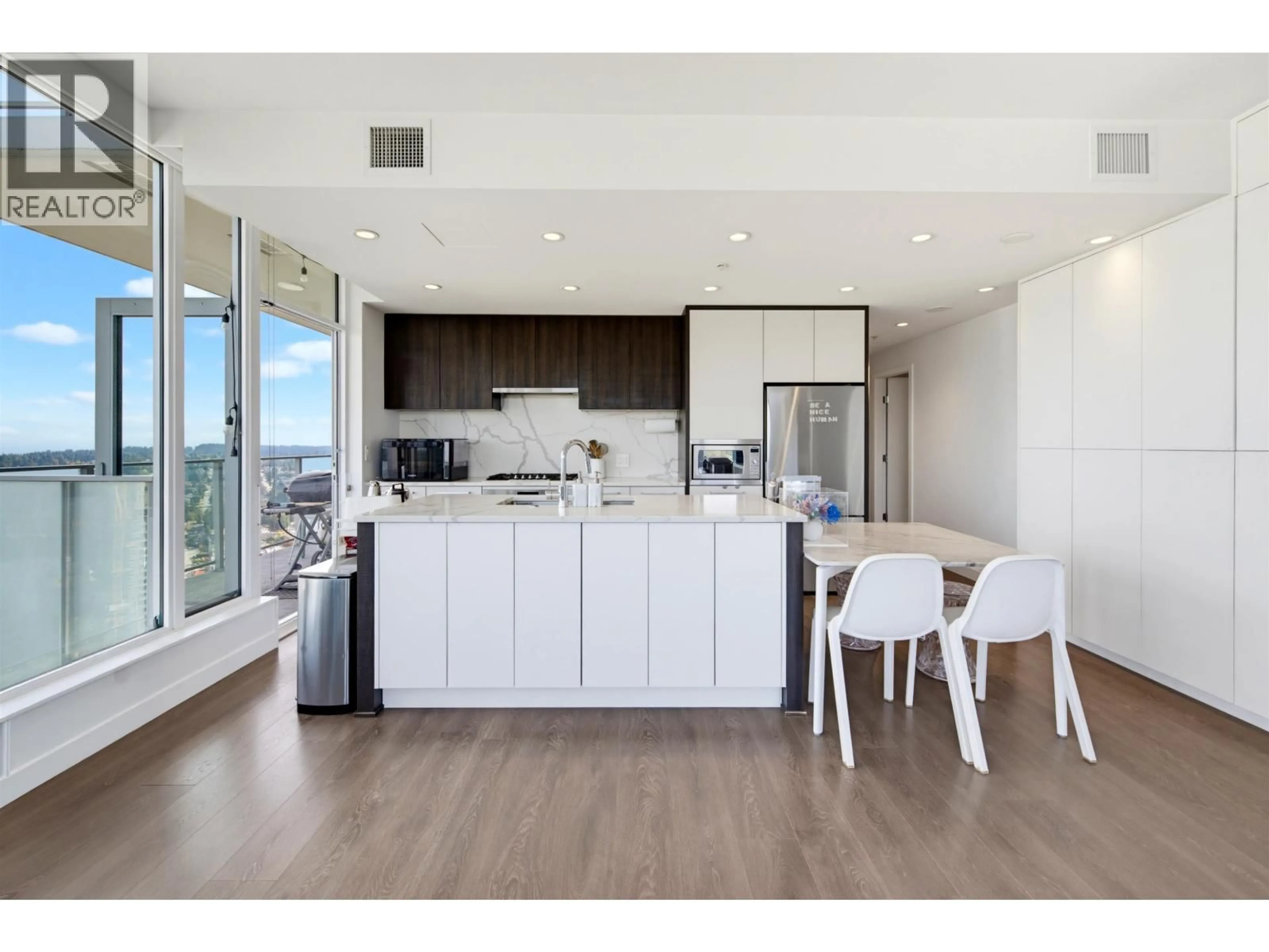 Open concept kitchen, wood/laminate floor for 4003 - 567 CLARKE ROAD, Coquitlam British Columbia V3J0K7