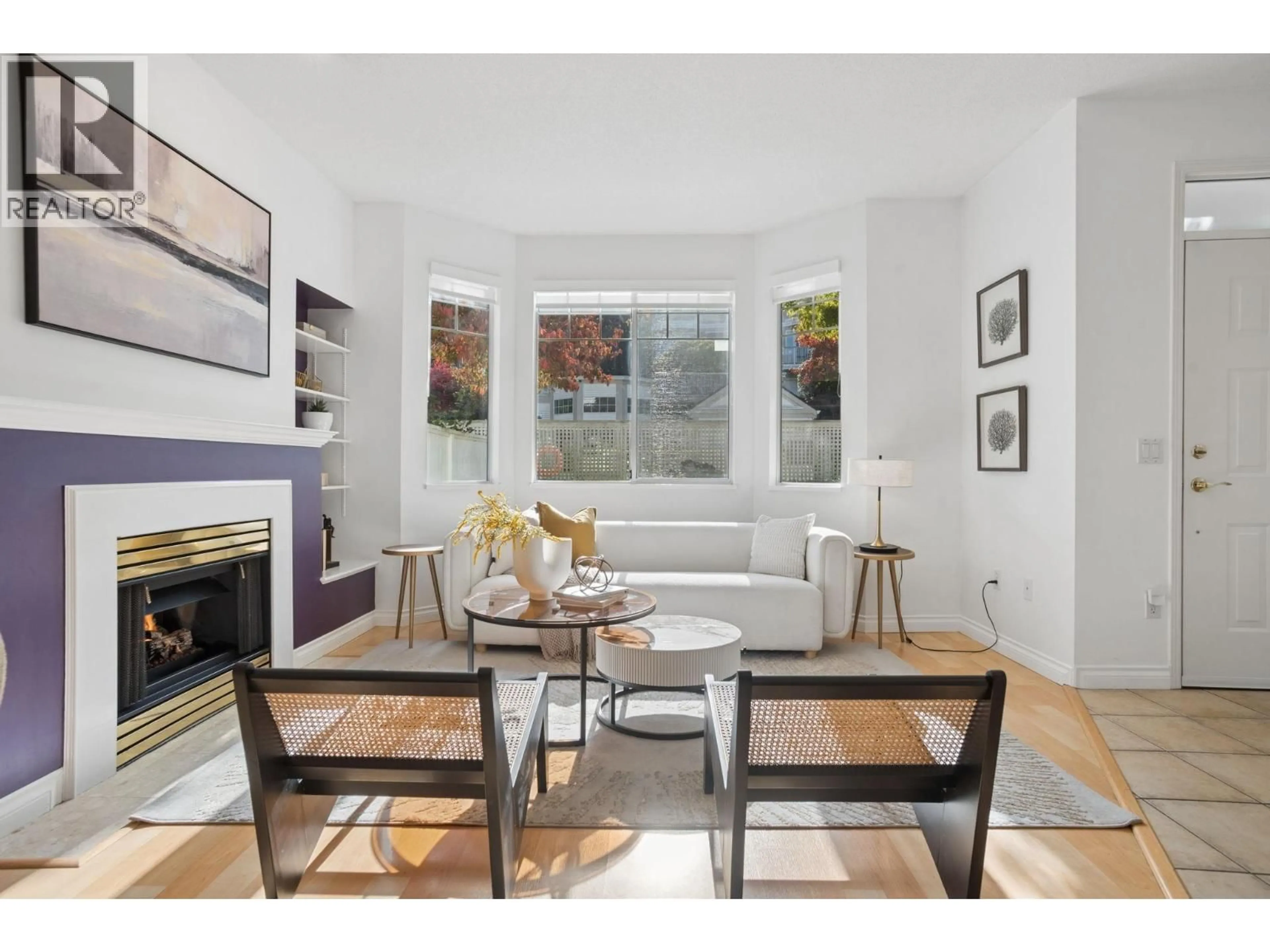 Living room with furniture, wood/laminate floor for 94 - 7501 CUMBERLAND STREET, Burnaby British Columbia V3N4Y6