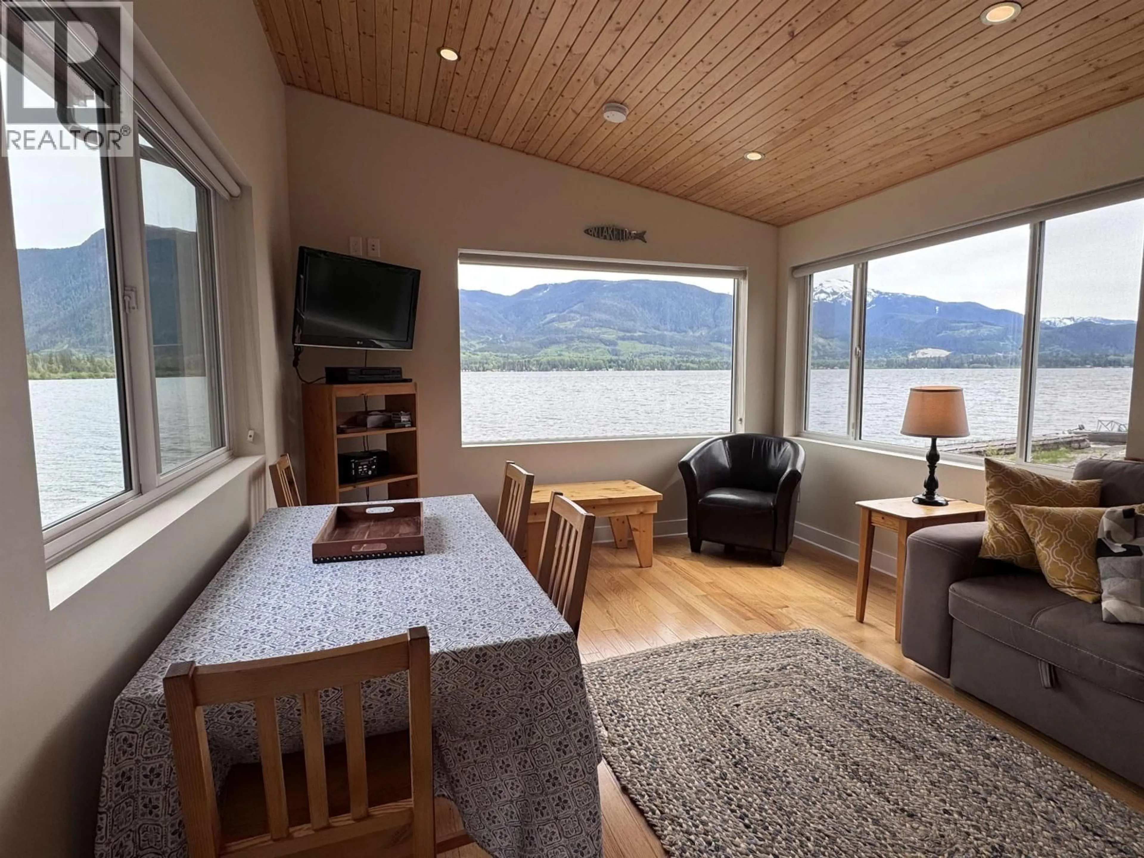 Living room with furniture, wood/laminate floor for 1440 WESTSIDE ROAD, Terrace British Columbia V8G4B8