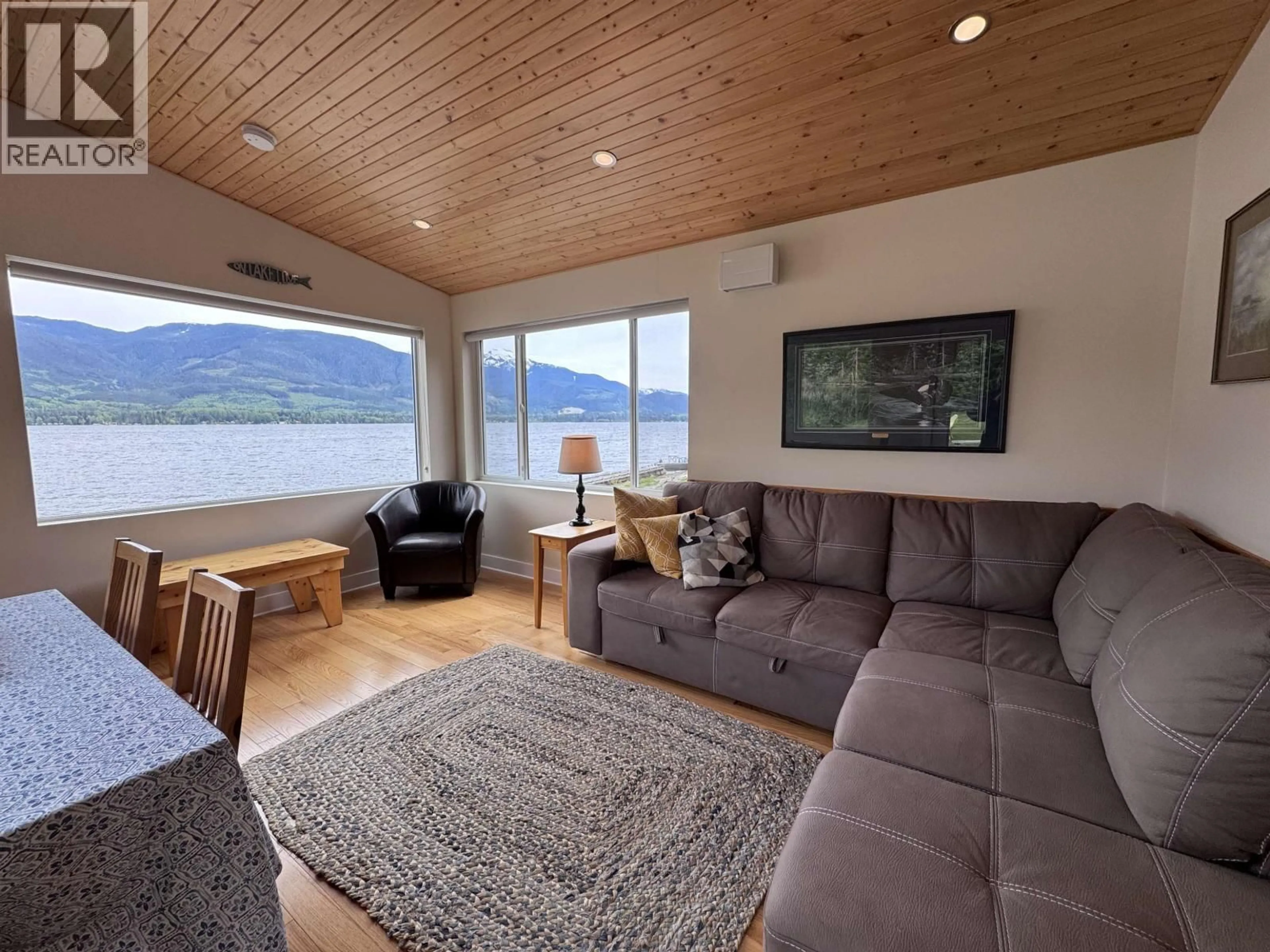 Living room with furniture, wood/laminate floor for 1440 WESTSIDE ROAD, Terrace British Columbia V8G4B8