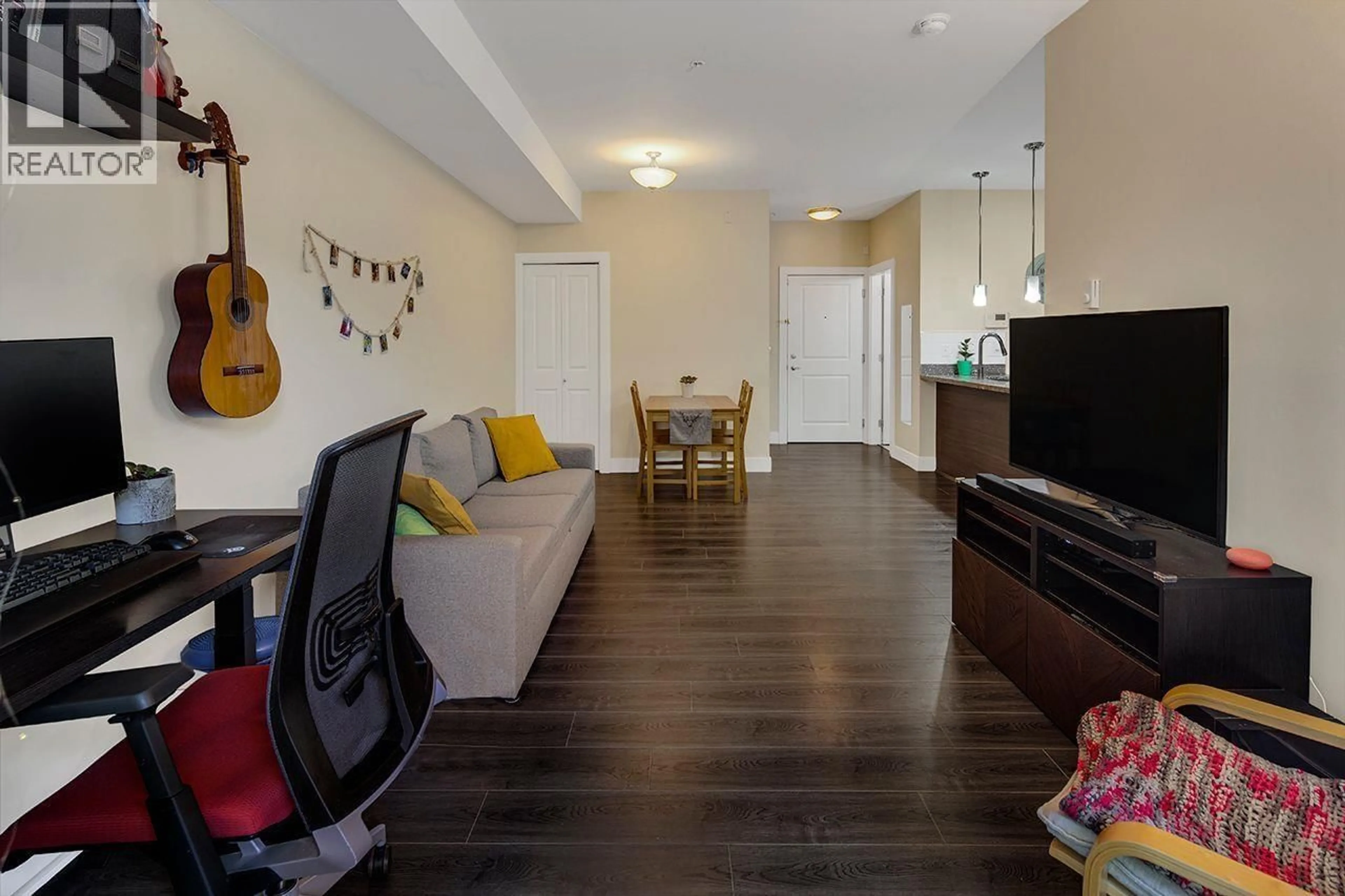 Living room with furniture, wood/laminate floor for 106 - 7377 14TH AVENUE, Burnaby British Columbia V3N1Z7