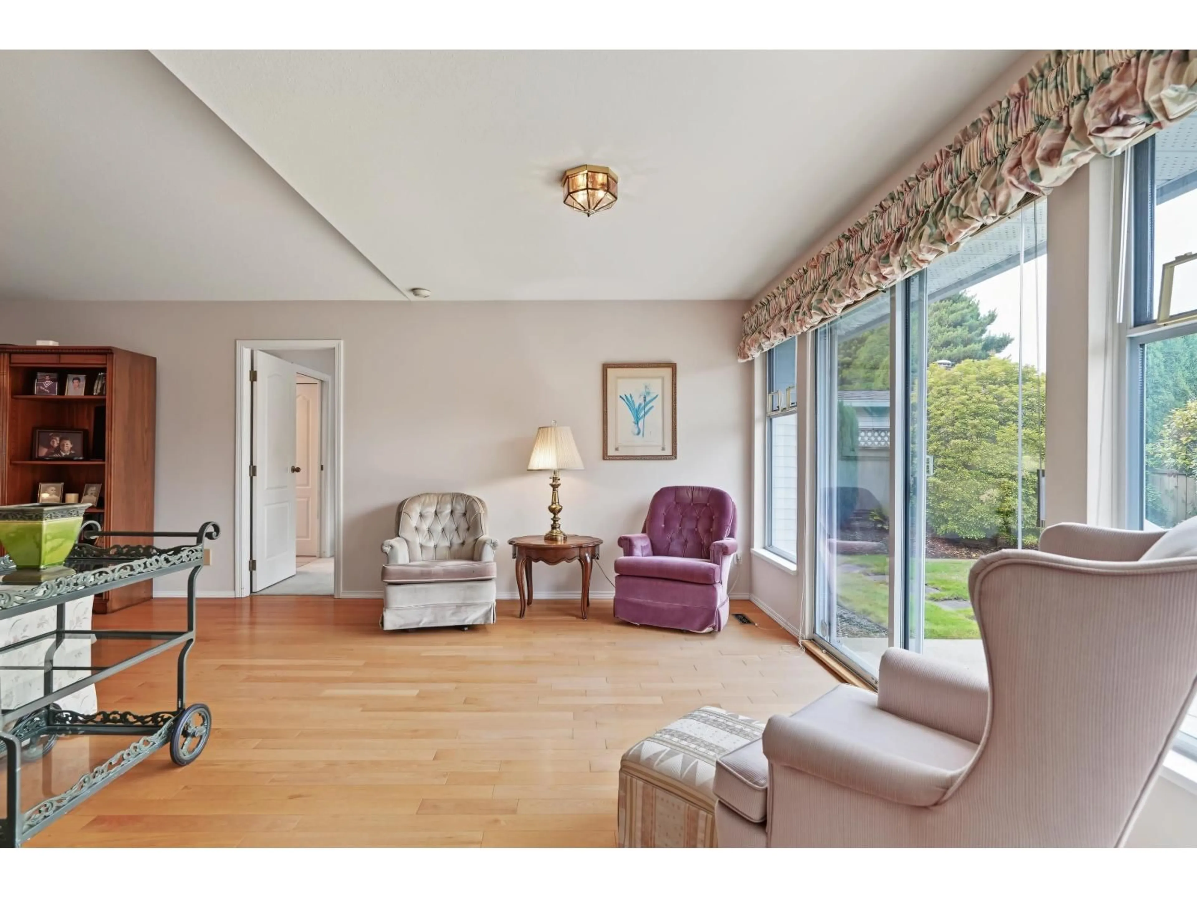 Living room with furniture, wood/laminate floor for 16155 16A AVENUE, Surrey British Columbia V4A9J9