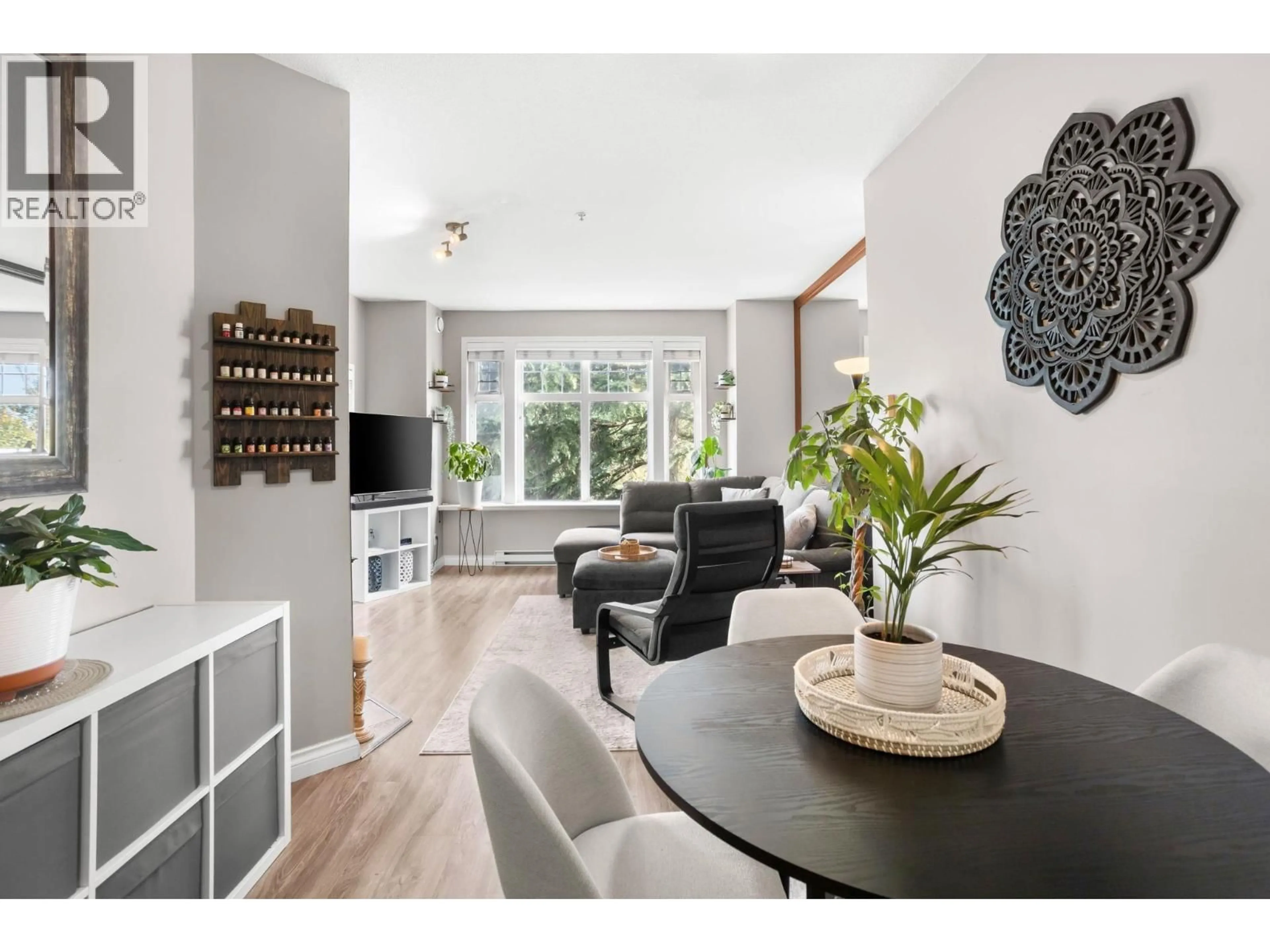 Living room with furniture, wood/laminate floor for 211 - 83 STAR CRESCENT, New Westminster British Columbia V3M6X8
