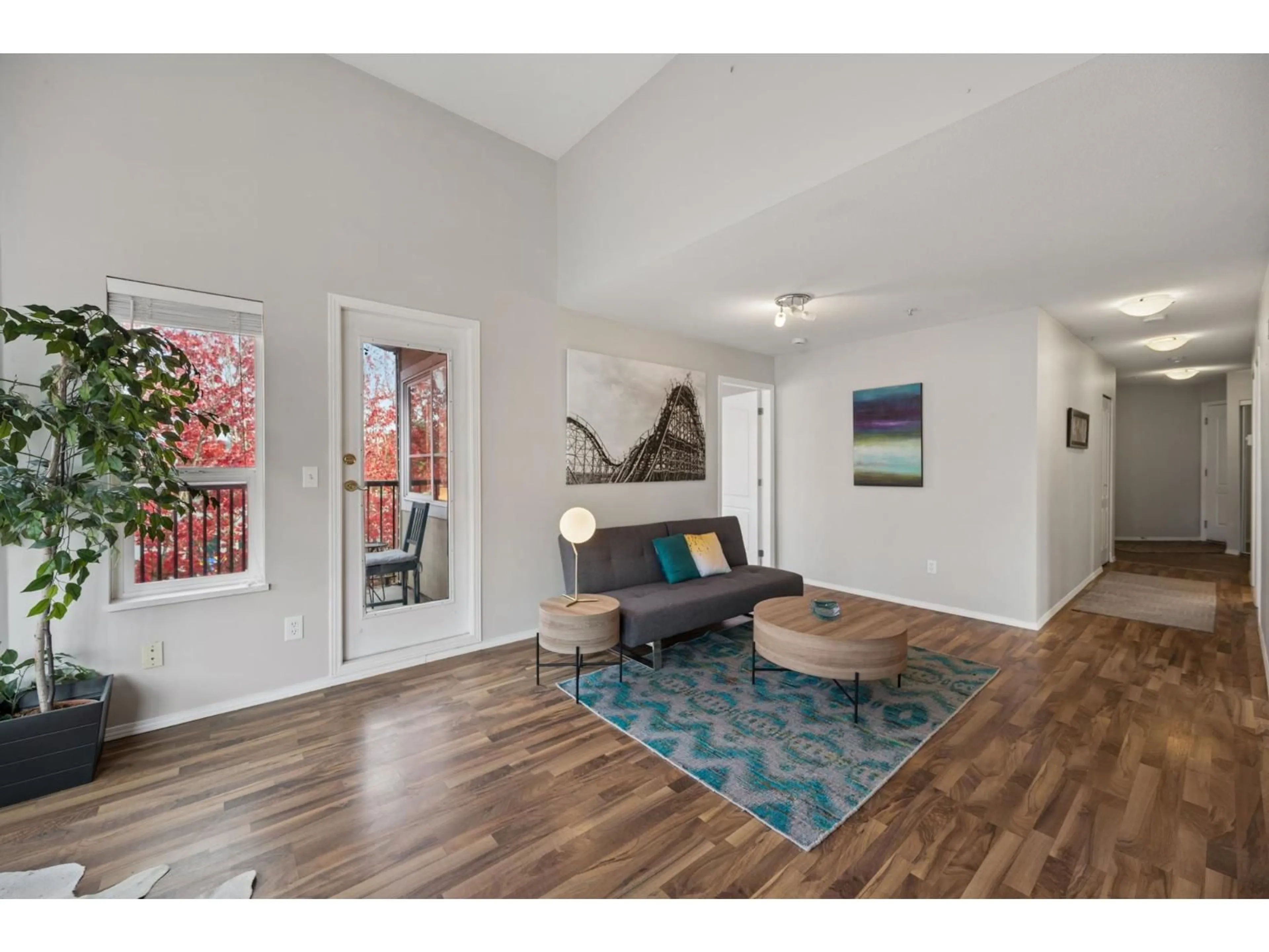 Living room with furniture, wood/laminate floor for 406 - 5765 GLOVER ROAD, Langley British Columbia V3A8M8