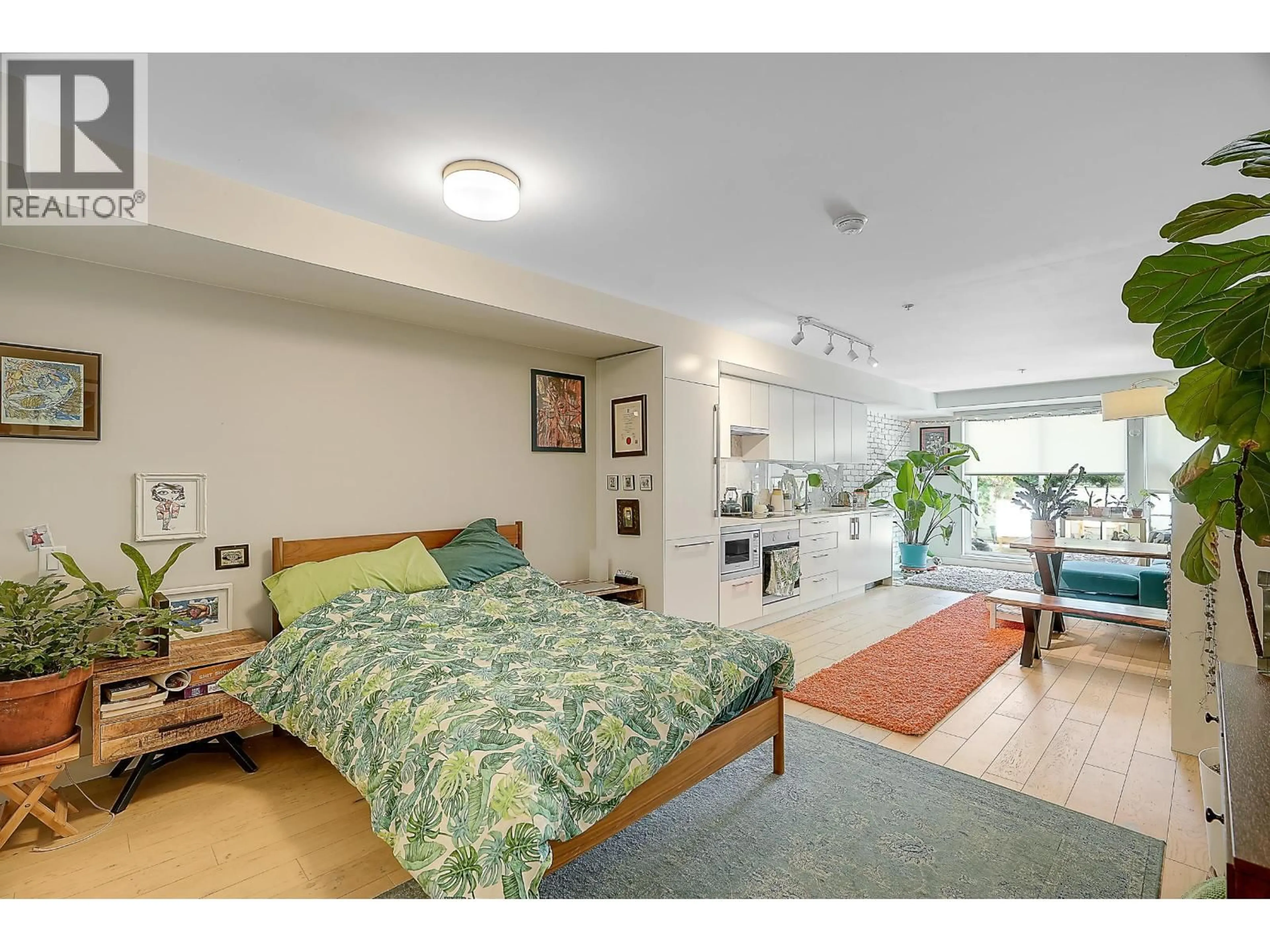Bedroom with bed, unknown for 210 - 2508 FRASER STREET, Vancouver British Columbia V5T3V4