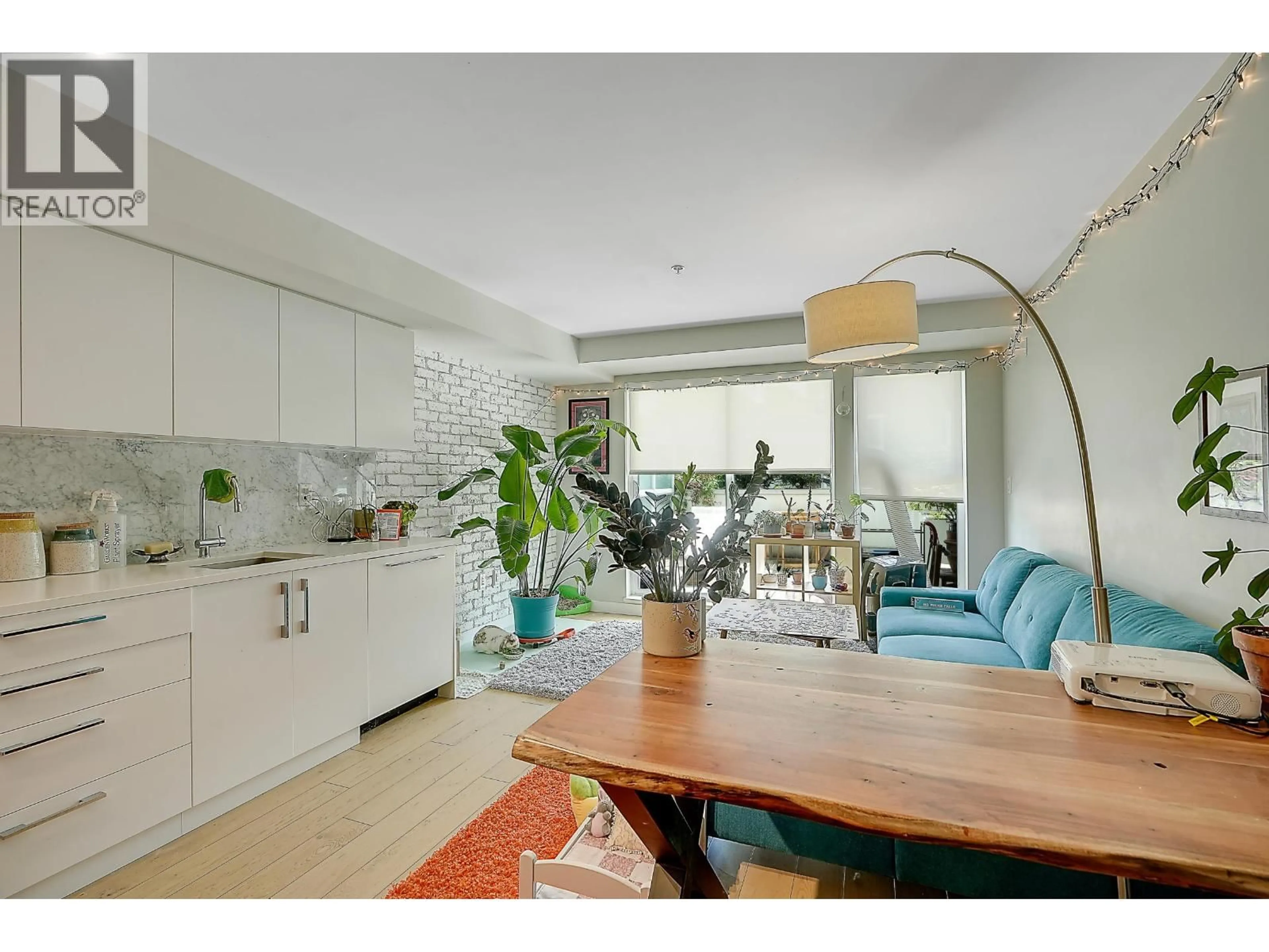 Open concept kitchen, unknown for 210 - 2508 FRASER STREET, Vancouver British Columbia V5T3V4