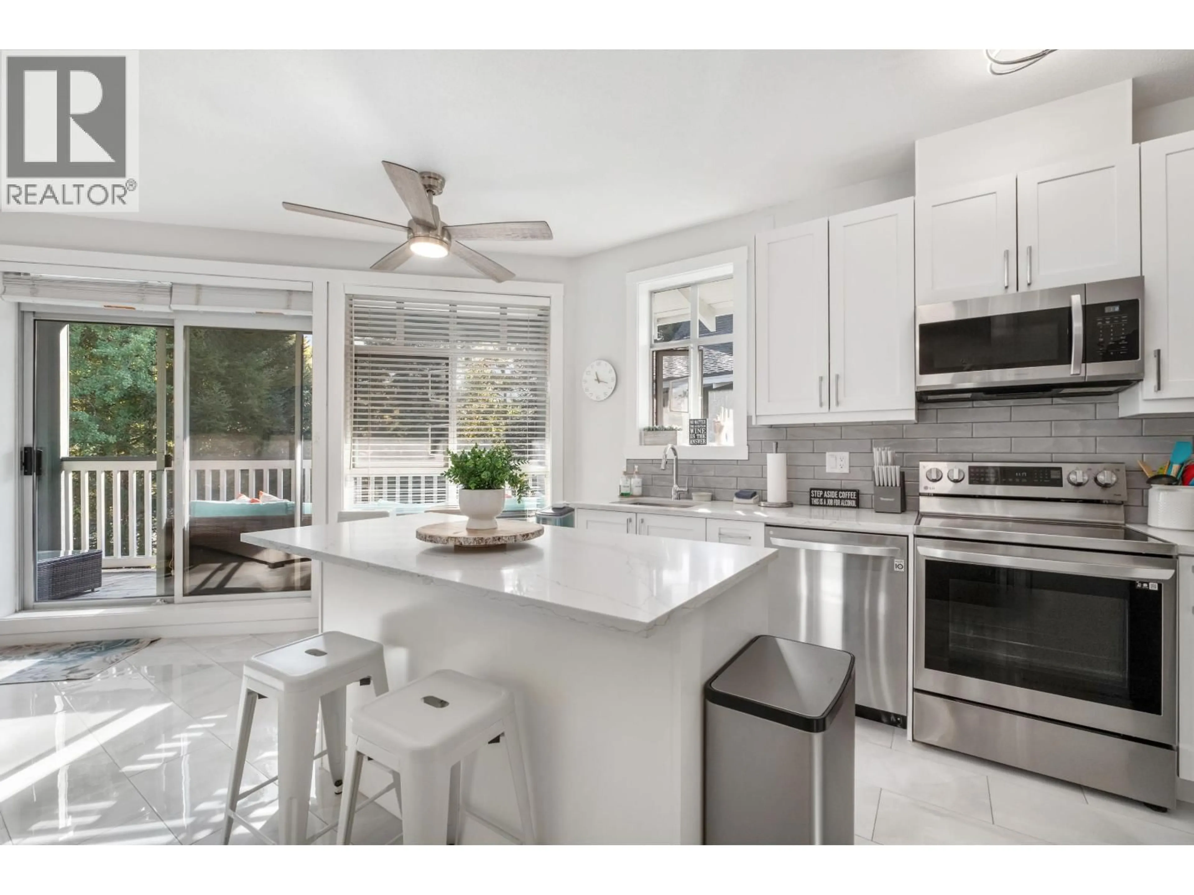Open concept kitchen, ceramic/tile floor for 311 - 4405 BLACKCOMB WAY, Whistler British Columbia V8E0X7