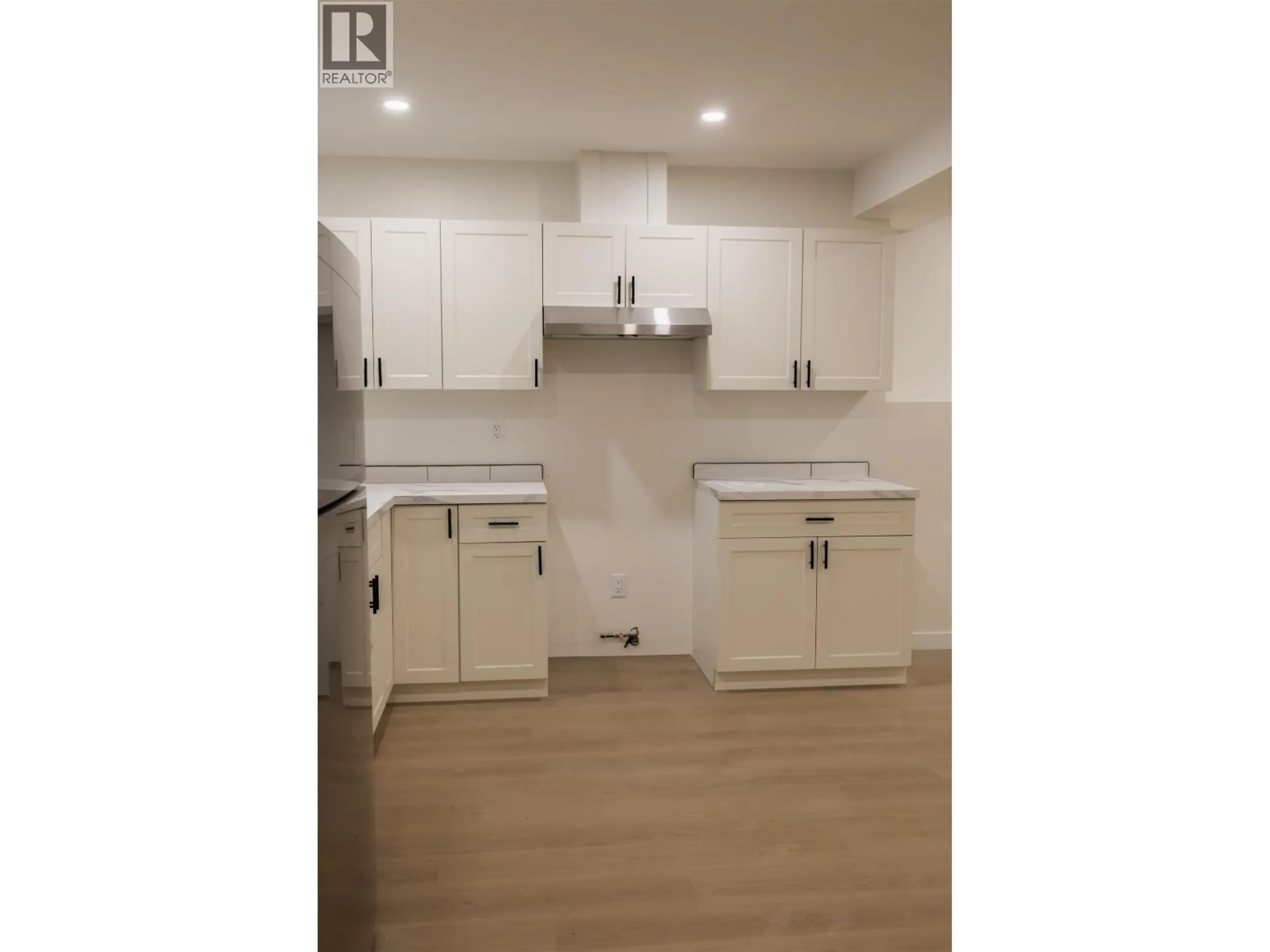 Open concept kitchen, wood/laminate floor for 2260 VICTORIA STREET, Prince George British Columbia V2L2L9