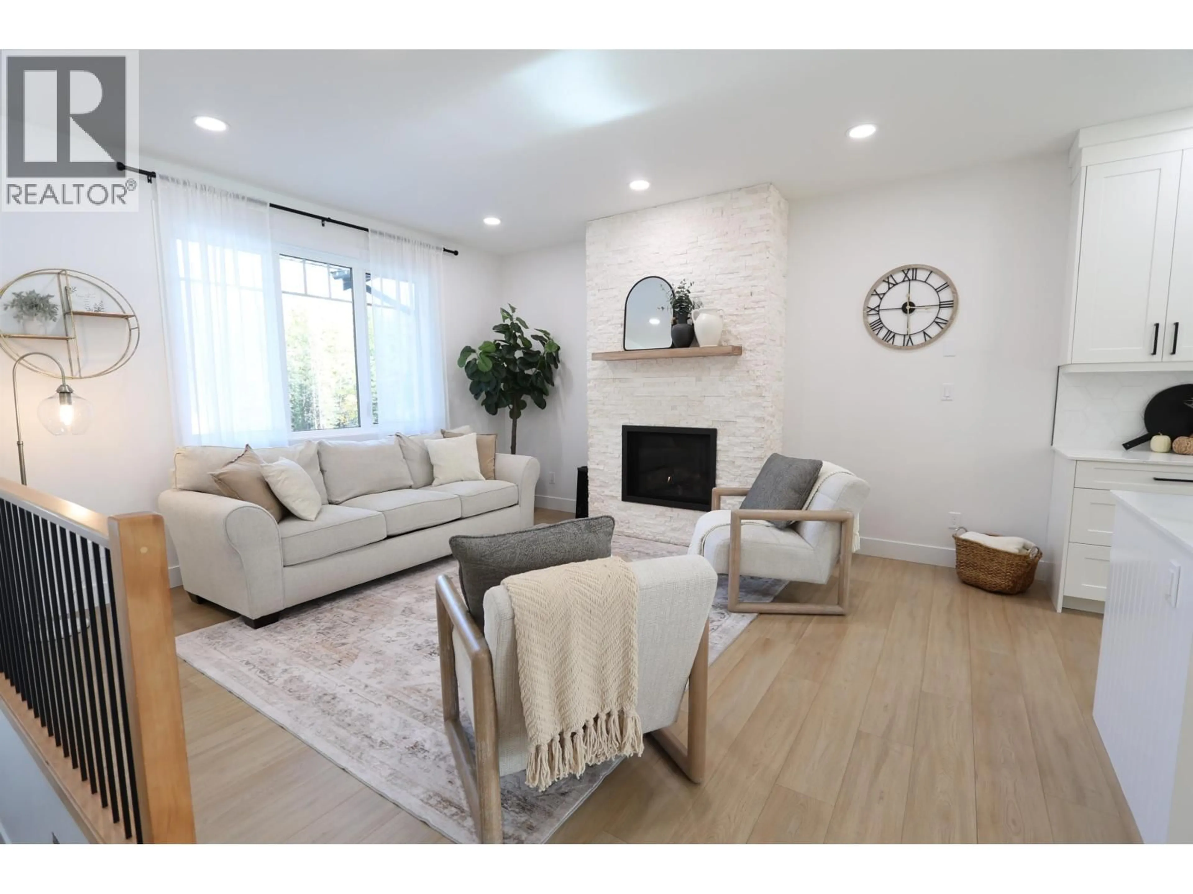 Living room with furniture, wood/laminate floor for 51925 GUEST FRONTAGE ROAD, Cluculz Lake British Columbia V0J3A3