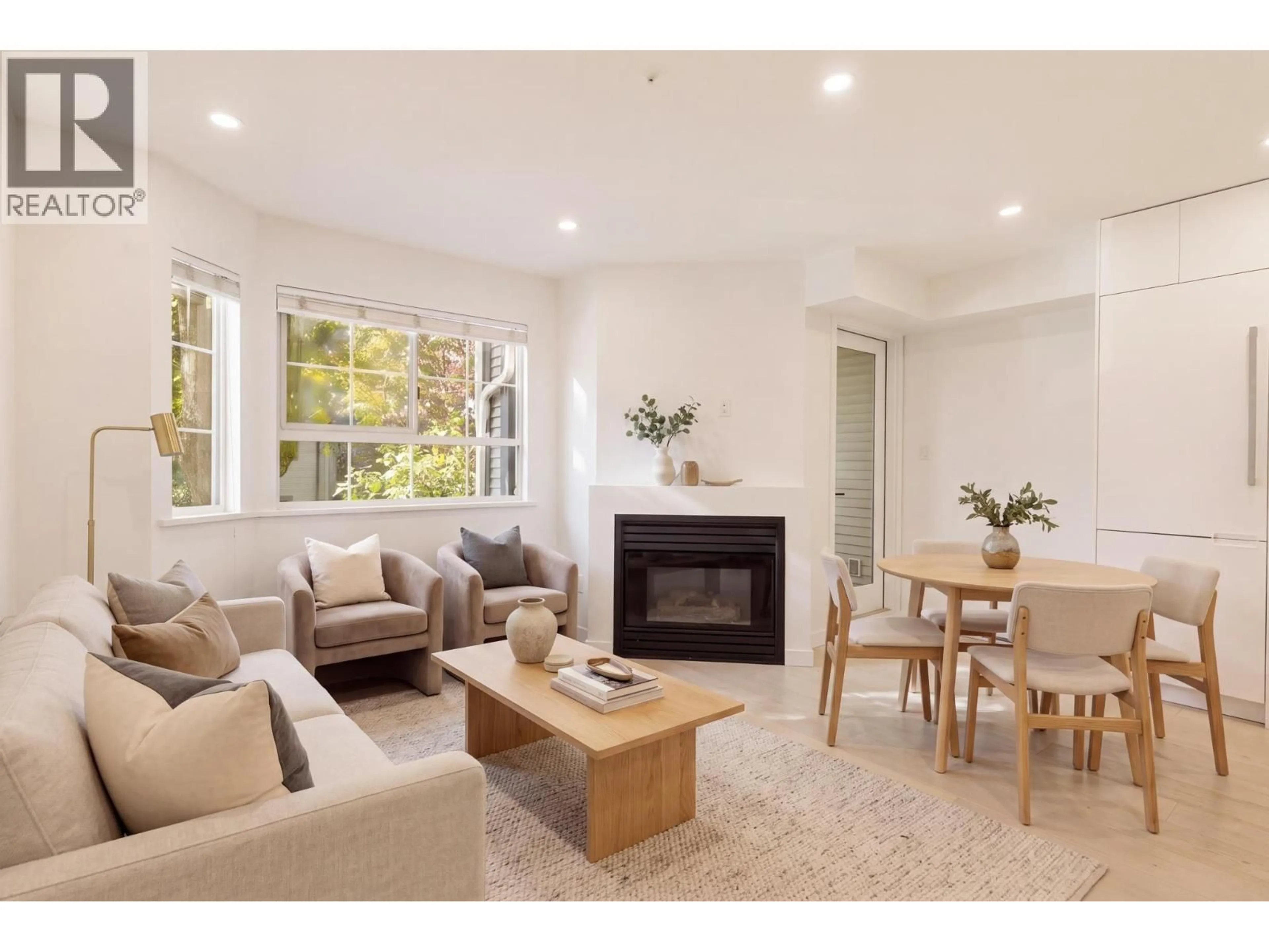 Living room with furniture, wood/laminate floor for 202 - 1520 COTTON DRIVE, Vancouver British Columbia V5L3V2