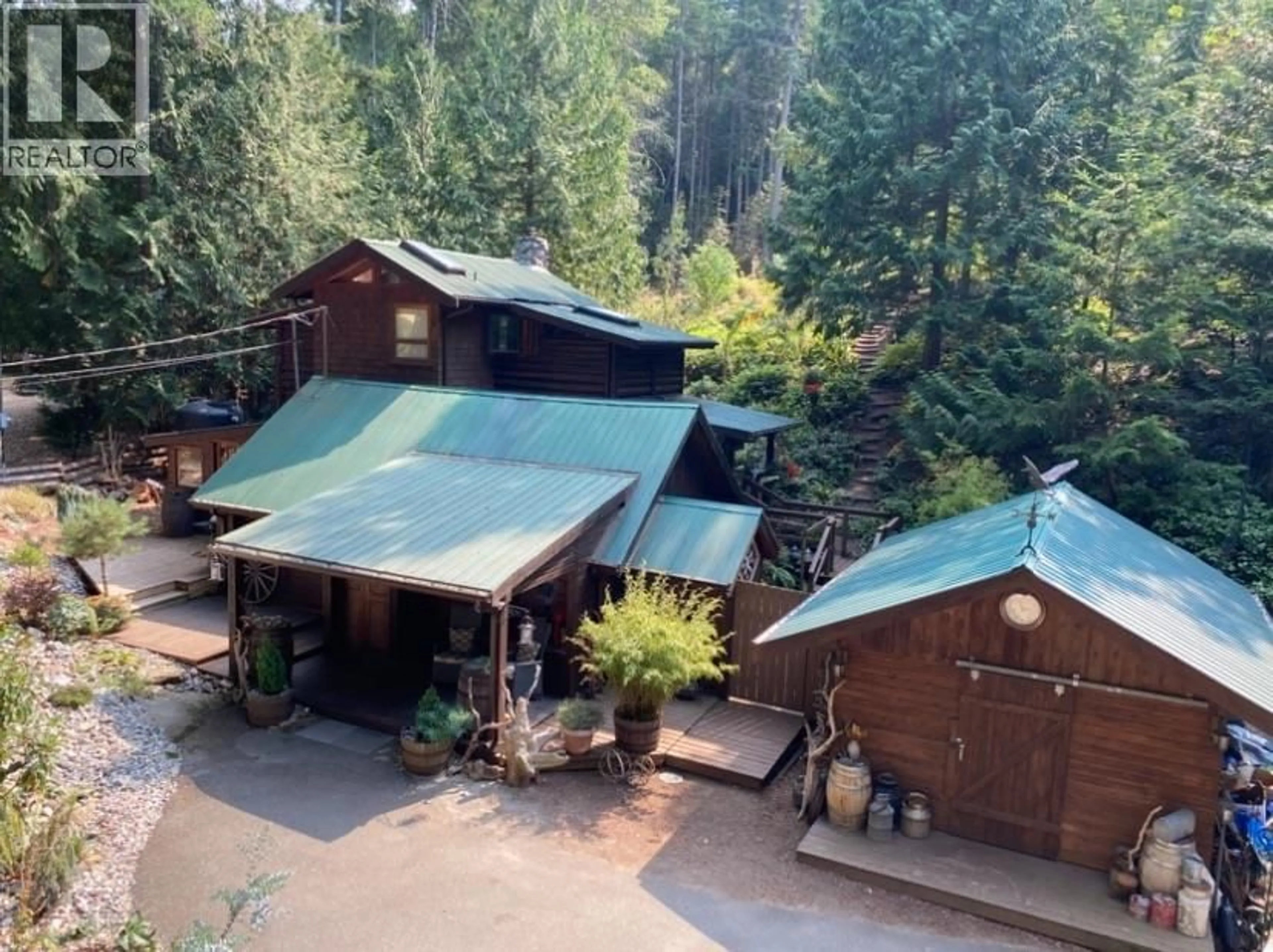 A pic from outside/outdoor area/front of a property/back of a property/a pic from drone, forest/trees view for 604 WAUGH ROAD, Mayne Island British Columbia V0N2J1
