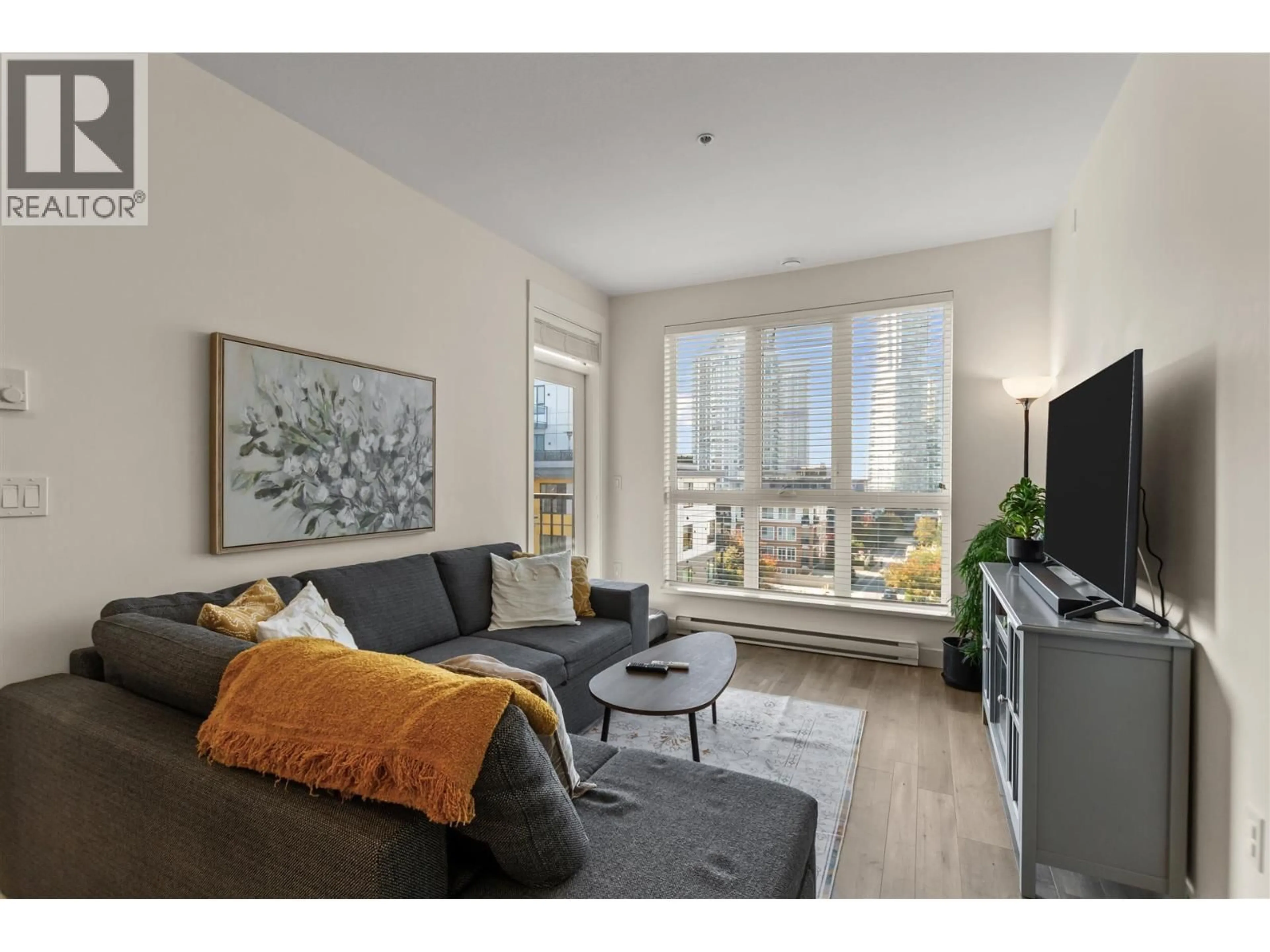 Living room with furniture, wood/laminate floor for 411 - 750 DOGWOOD STREET, Coquitlam British Columbia V3J4B7