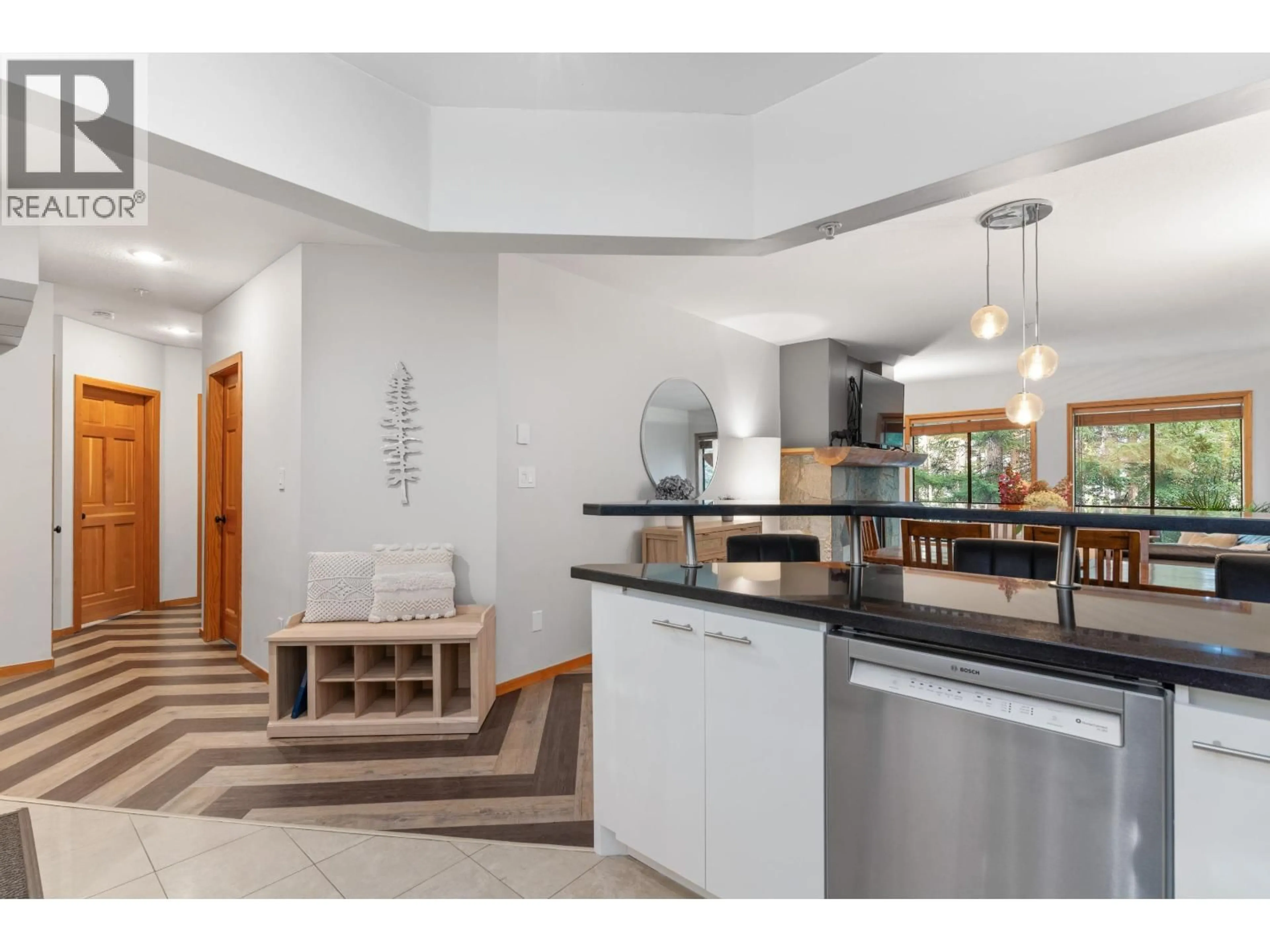 Open concept kitchen, ceramic/tile floor for 102 - 4821 SPEARHEAD DRIVE, Whistler British Columbia V8E1E8