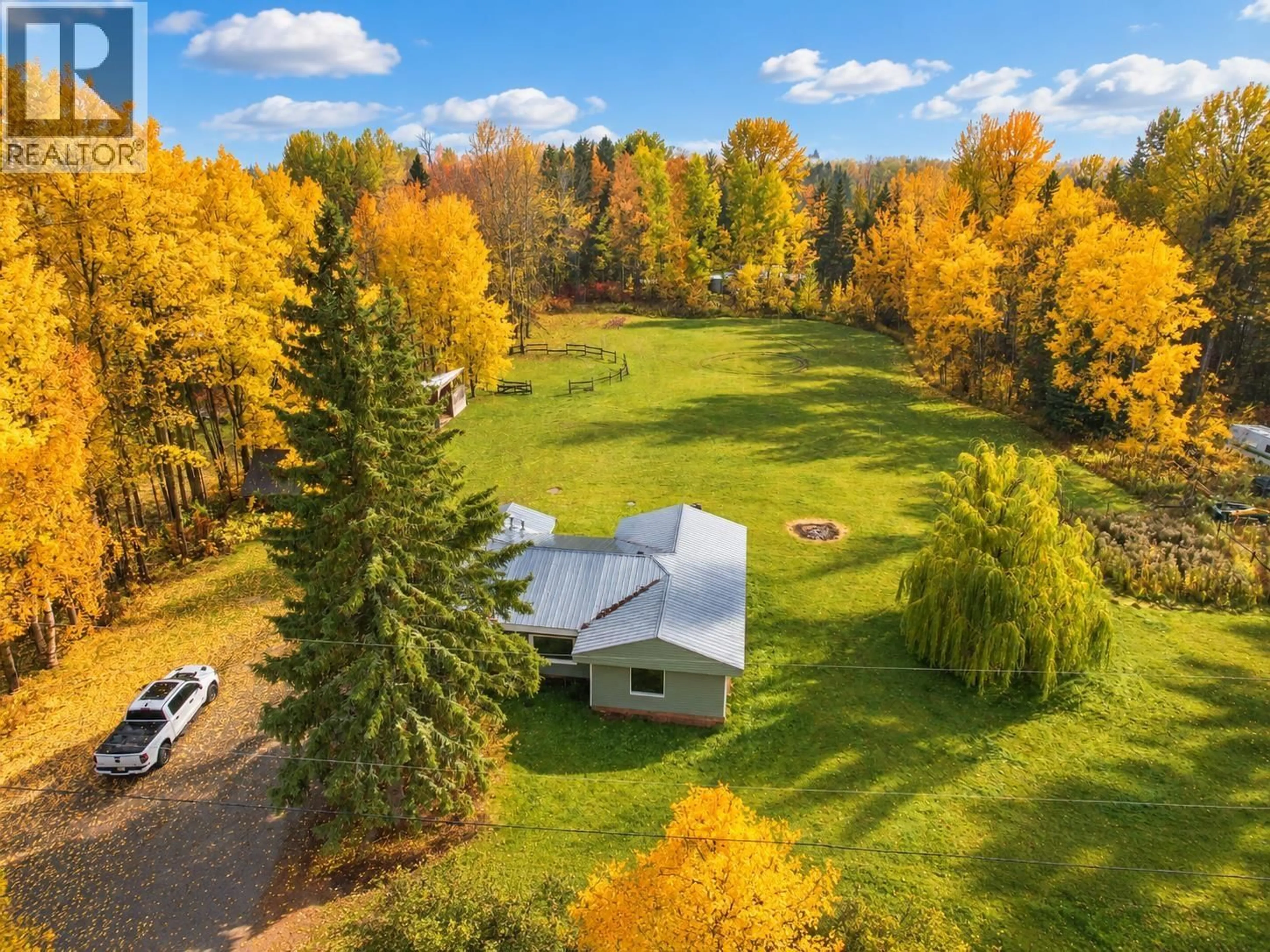 A pic from outside/outdoor area/front of a property/back of a property/a pic from drone, forest/trees view for 3925 AIRD ROAD, Quesnel British Columbia V2J6V8