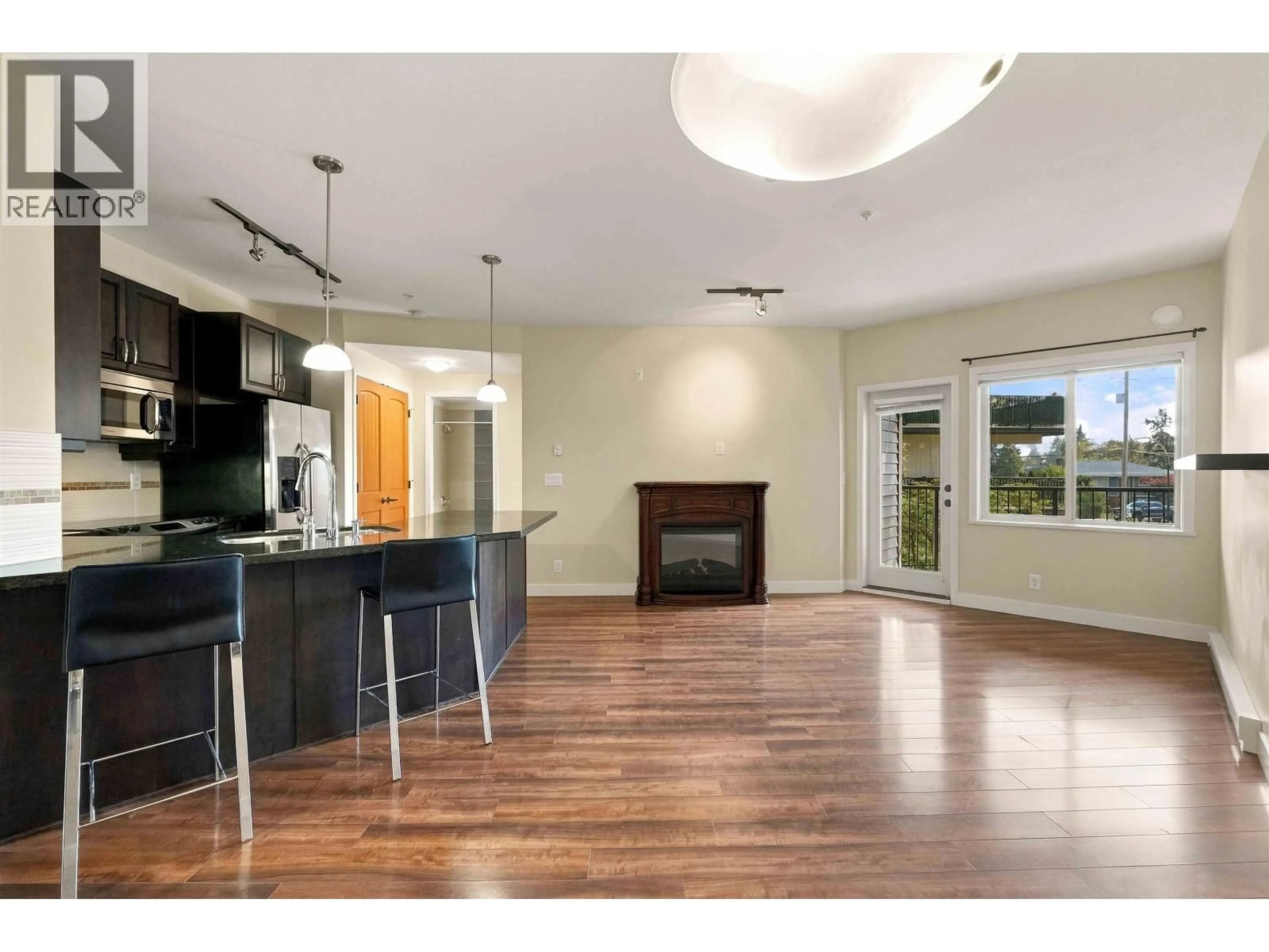 Open concept kitchen, wood/laminate floor for 216 - 11935 BURNETT STREET, Maple Ridge British Columbia V2X9A9