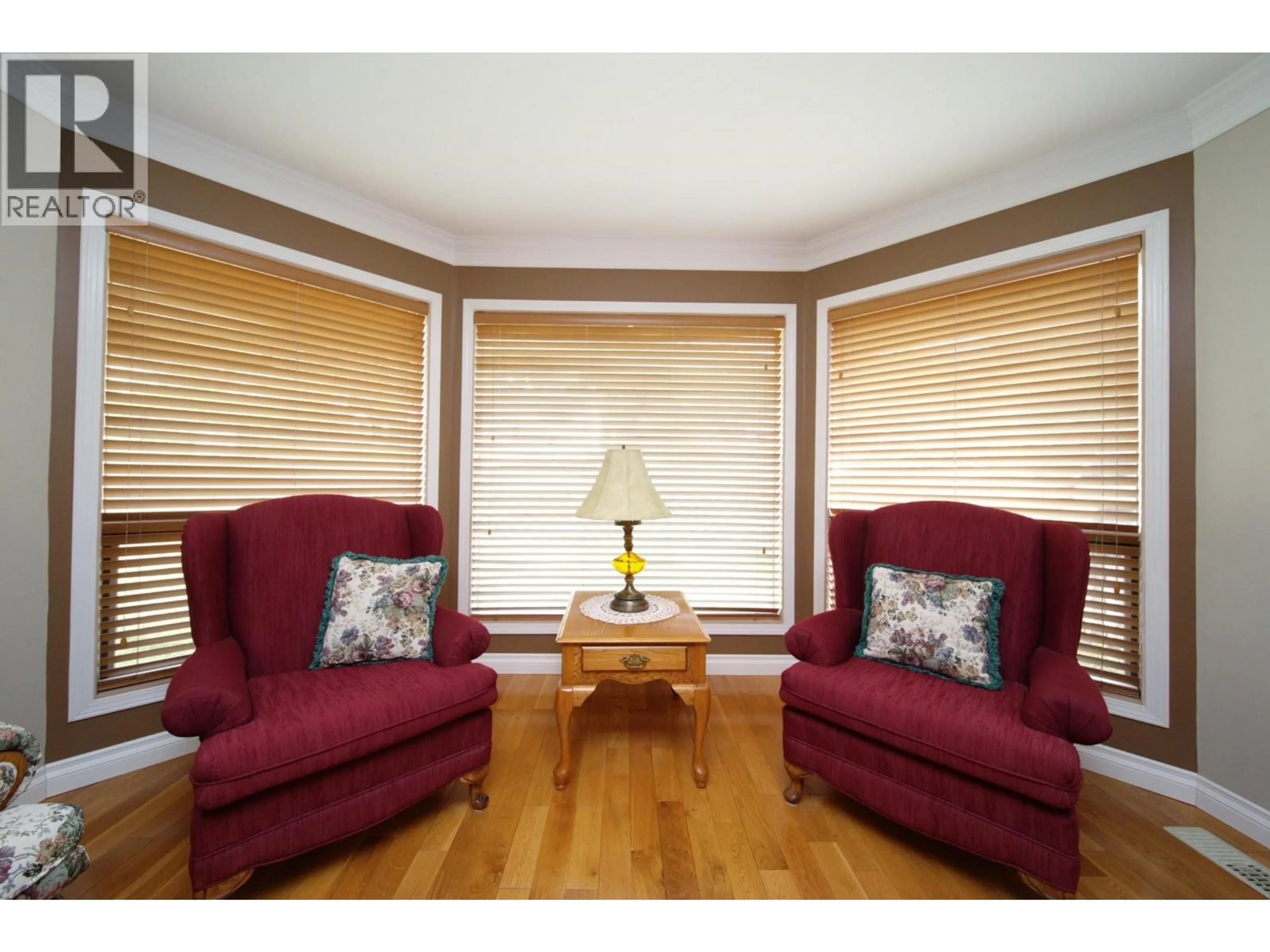 Living room with furniture, wood/laminate floor for 599 PEARKES DRIVE, Williams Lake British Columbia V2G4B1