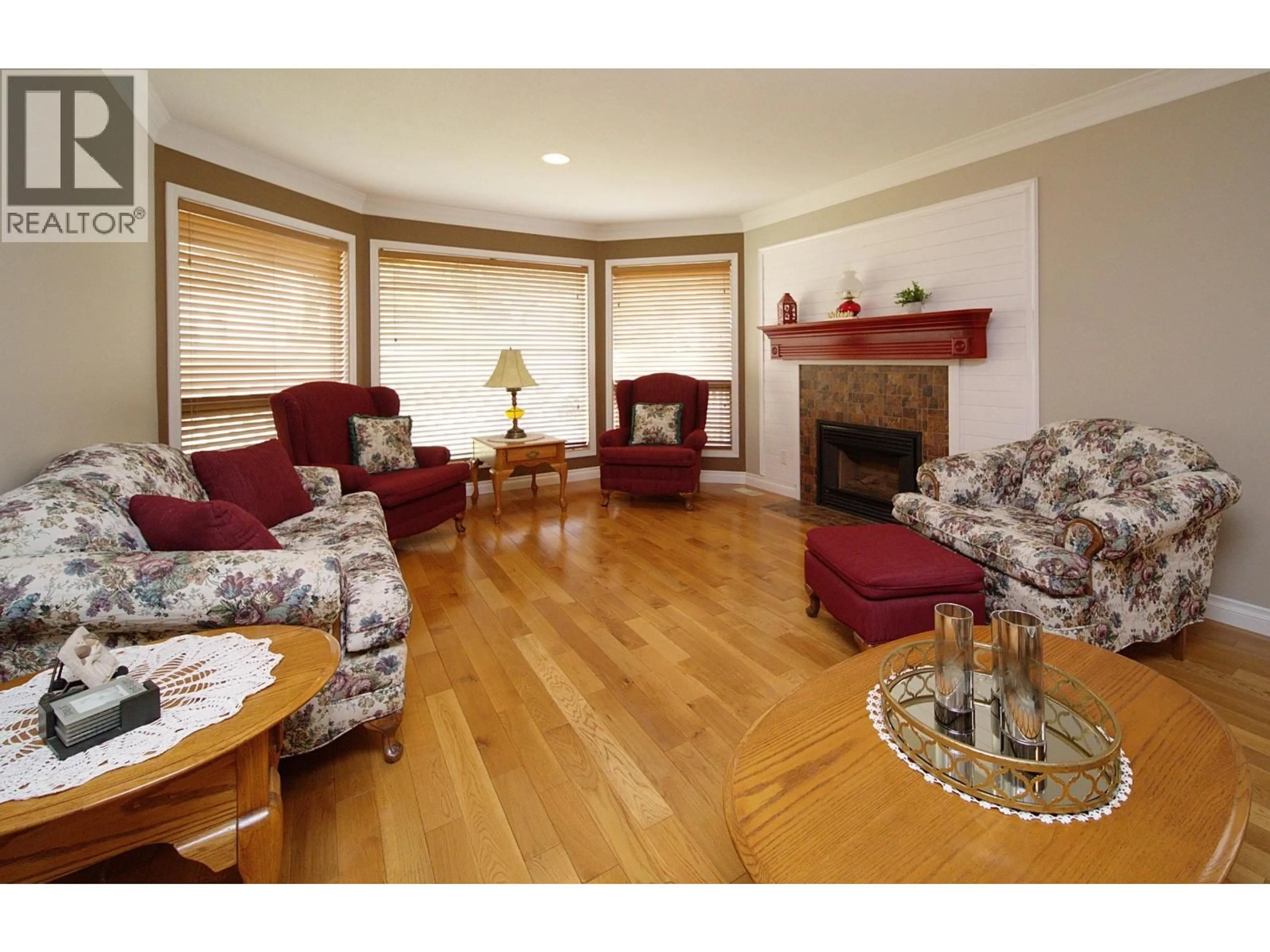 Living room with furniture, wood/laminate floor for 599 PEARKES DRIVE, Williams Lake British Columbia V2G4B1