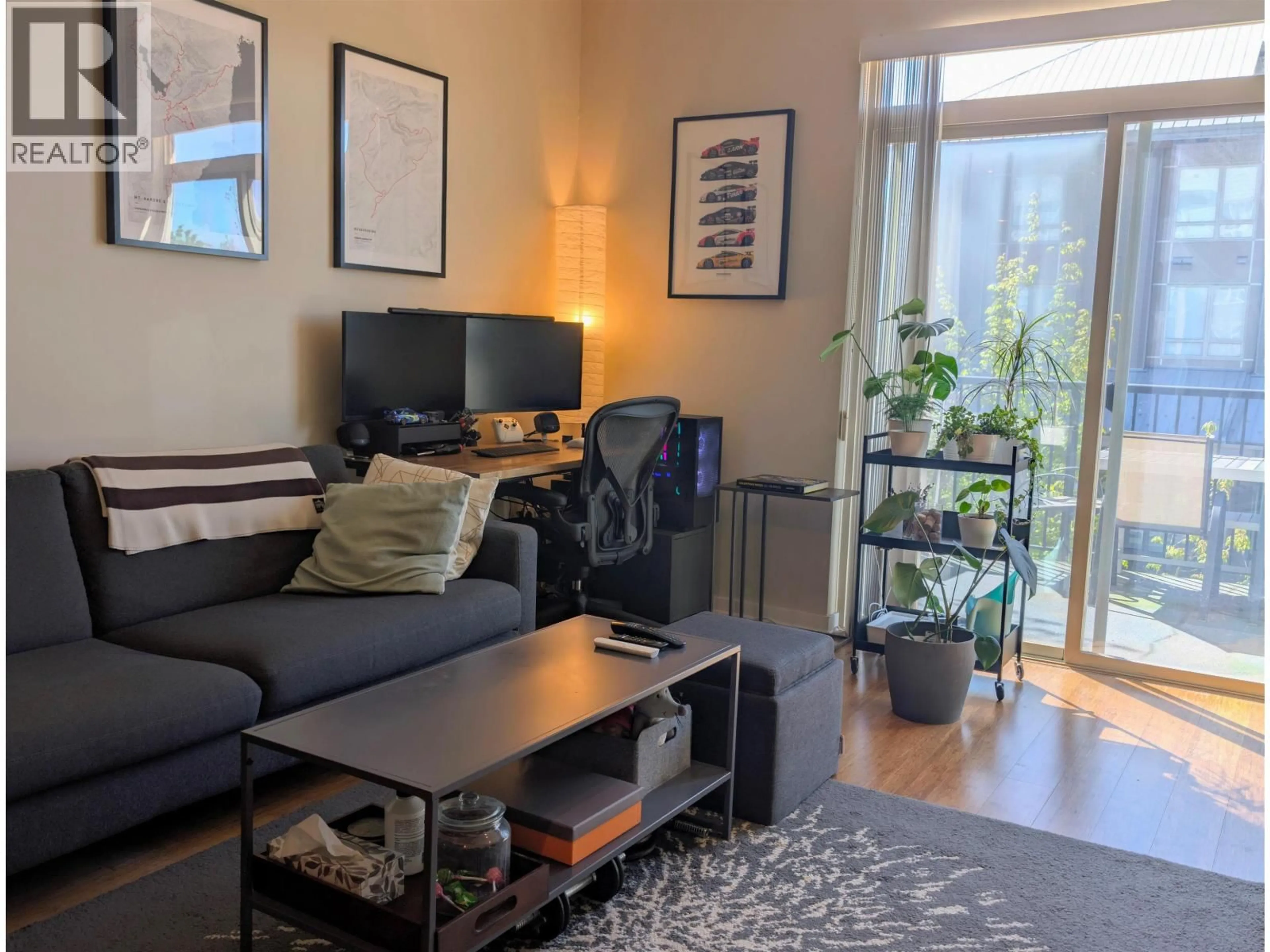 Living room with furniture, wood/laminate floor for 206 - 6077 LONDON ROAD, Richmond British Columbia V7E0A7